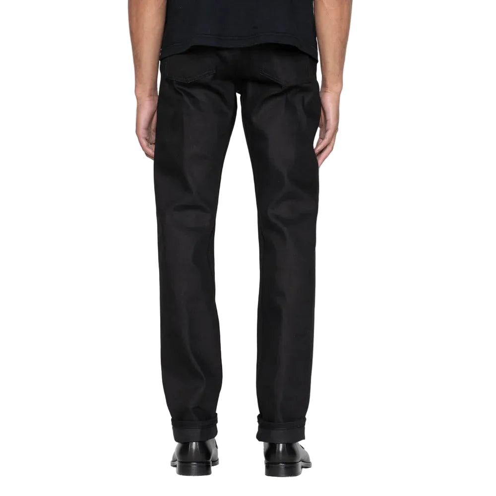 Person wearing black pants on a white background