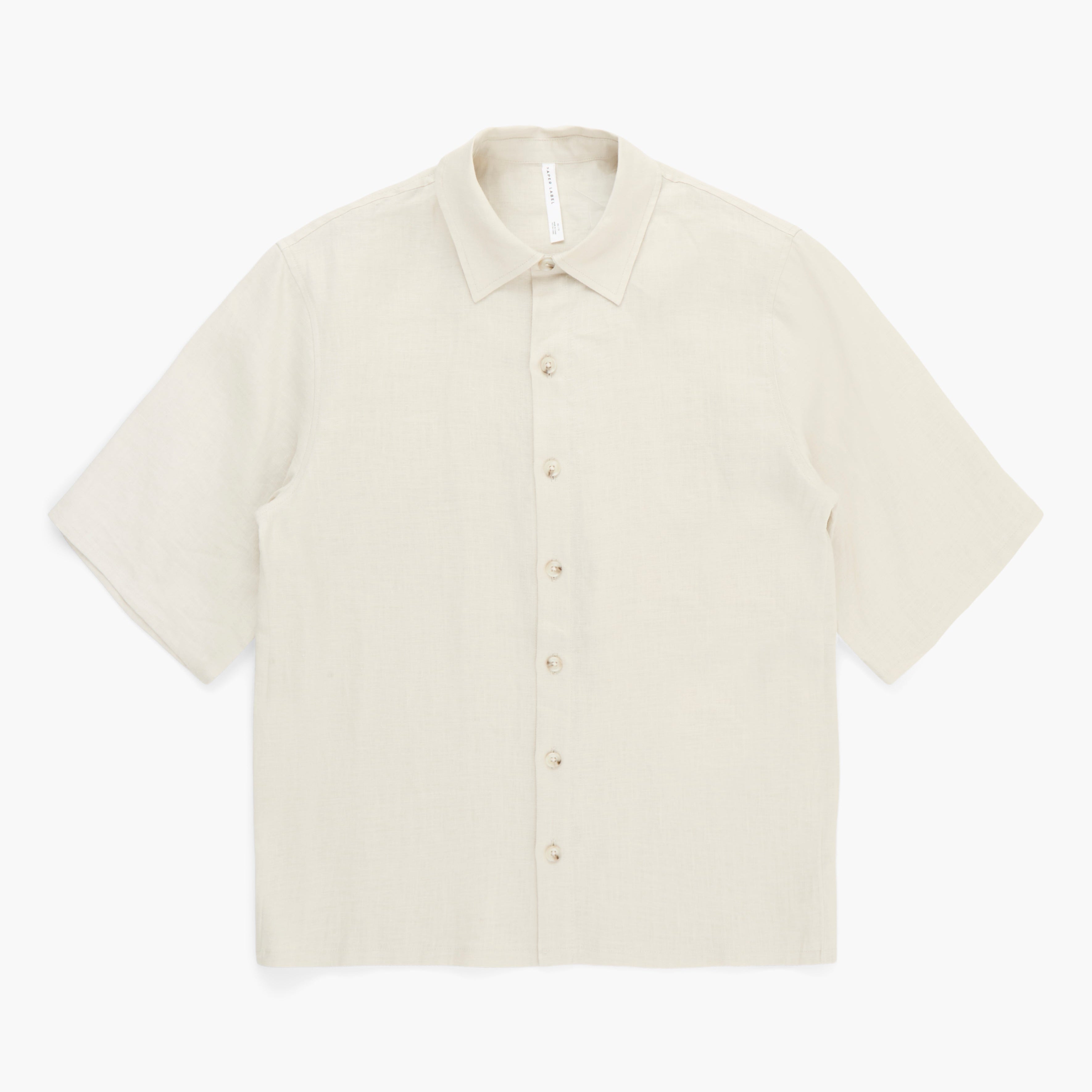 Beige short-sleeve shirt on a white background