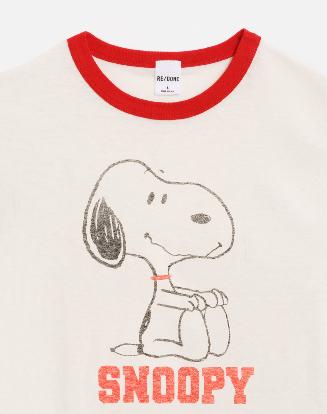 T-shirt with Snoopy graphic and 'RE/DONE' label on a white background