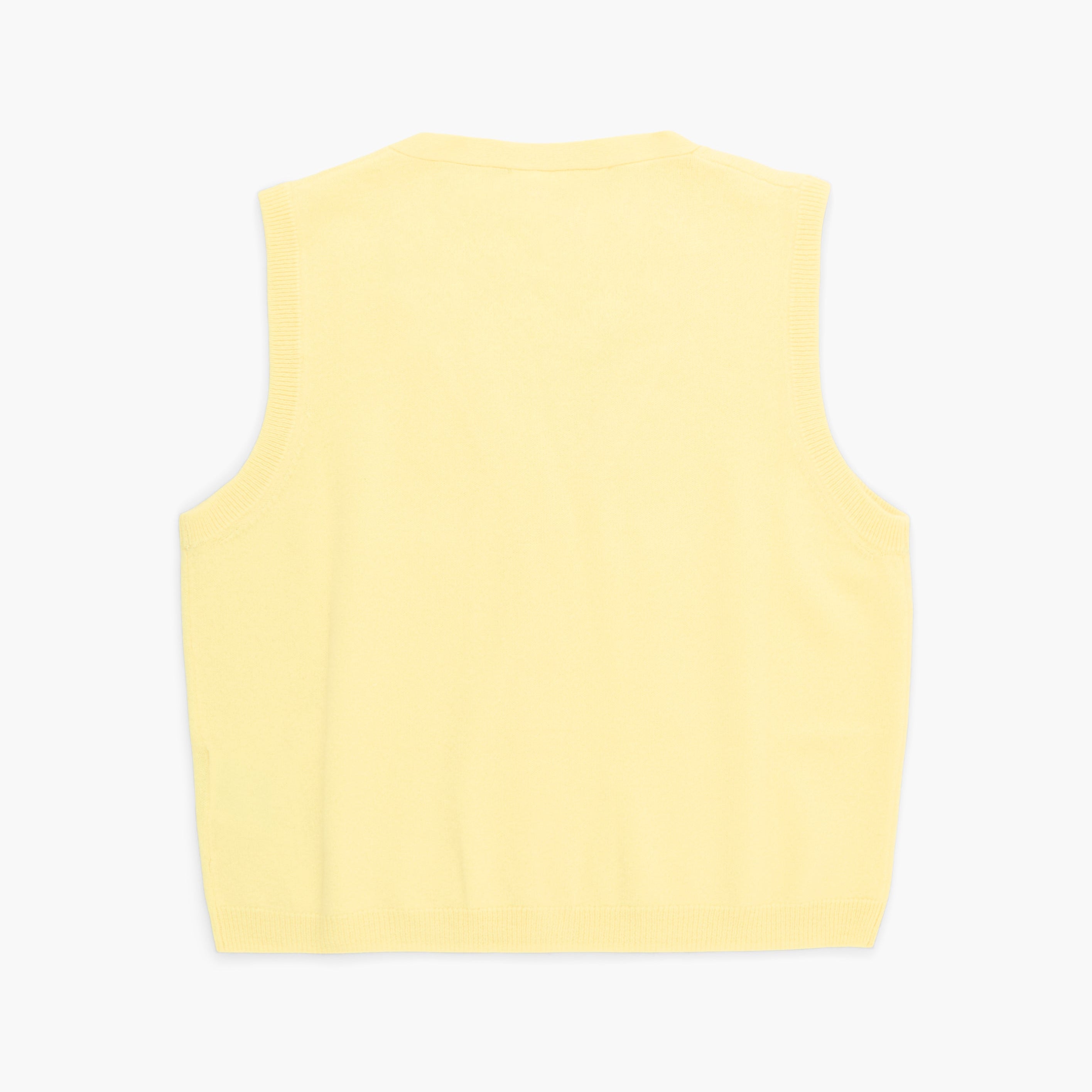 Yellow sleeveless top on a white background