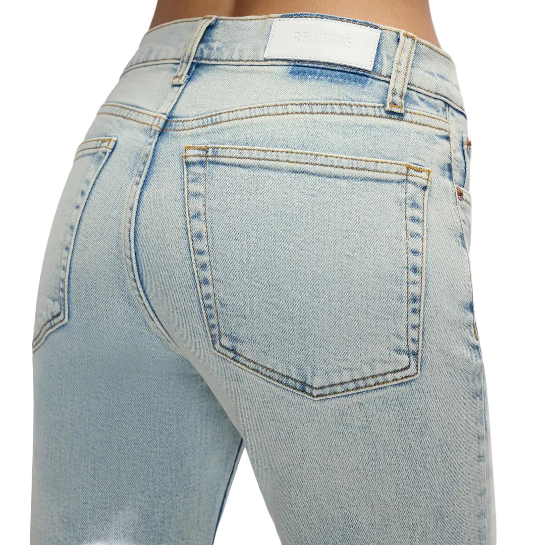 Light blue jeans with a visible brand label on a white background