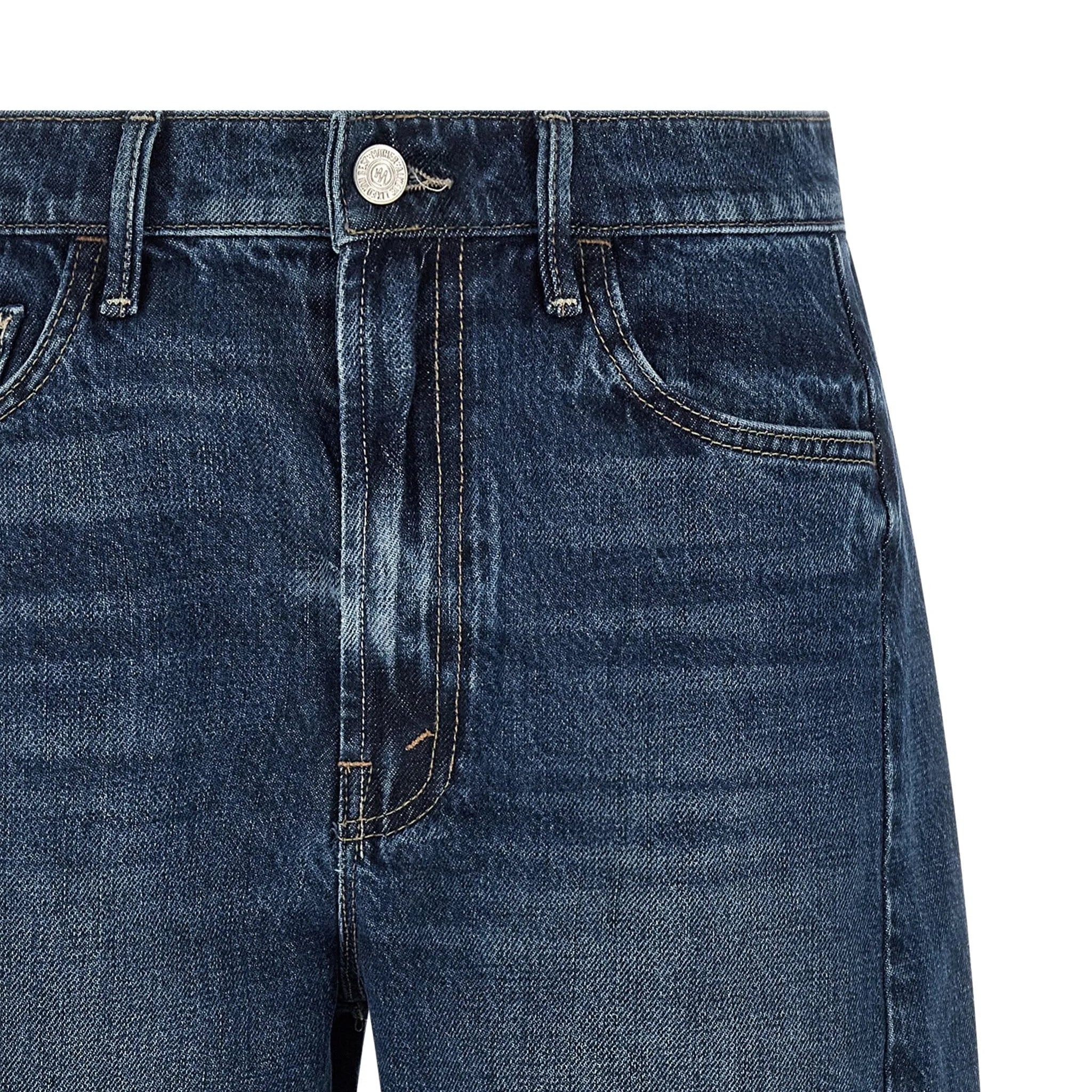 Close-up of blue jeans on a white background