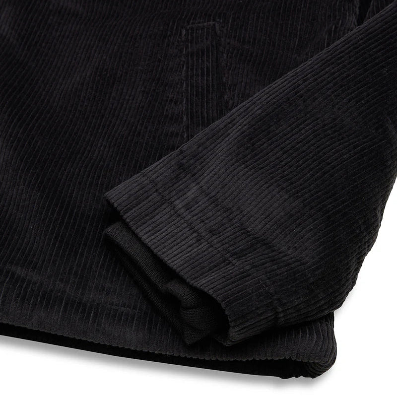 Close-up of a black textured fabric on a white background
