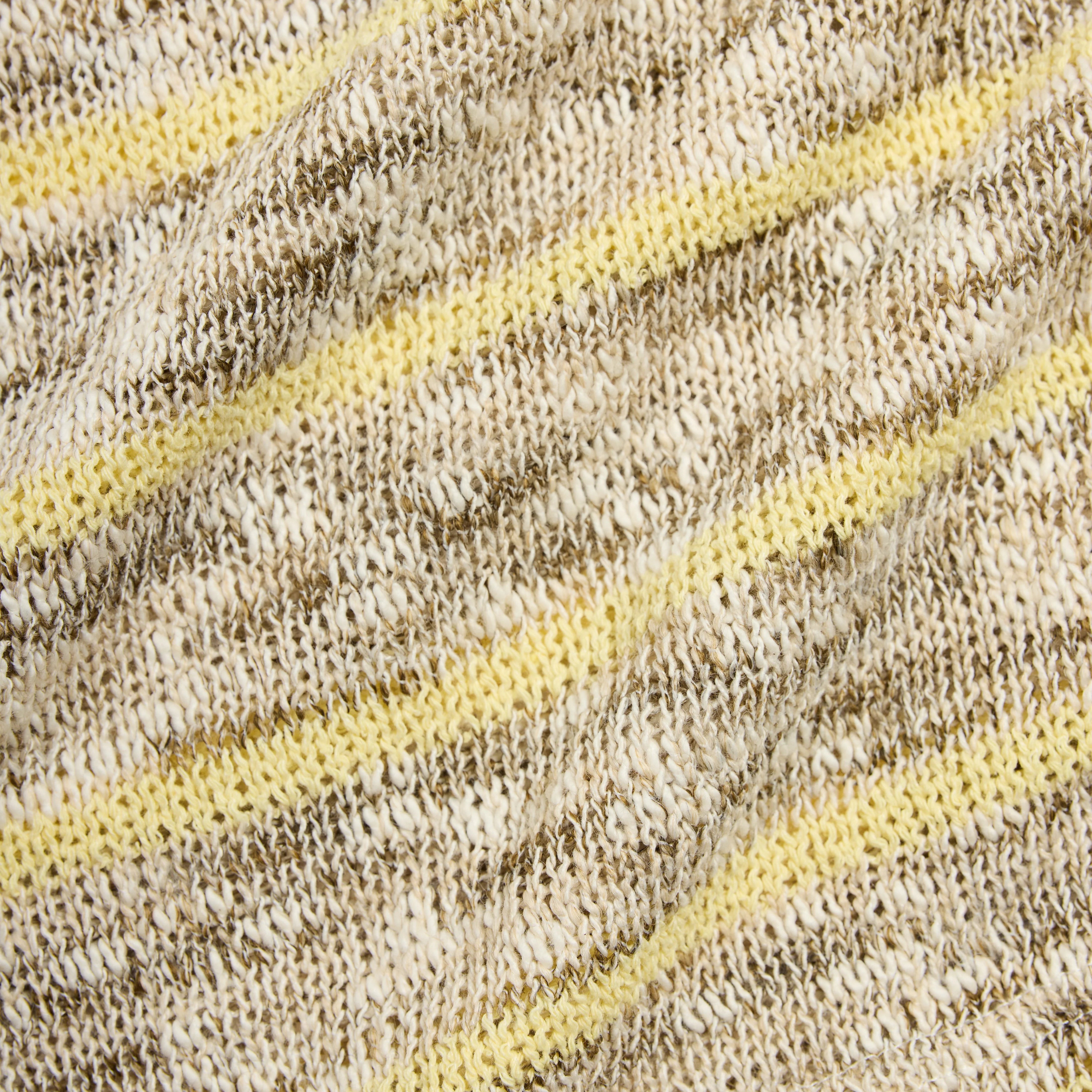 Close-up of textured fabric with yellow stripes