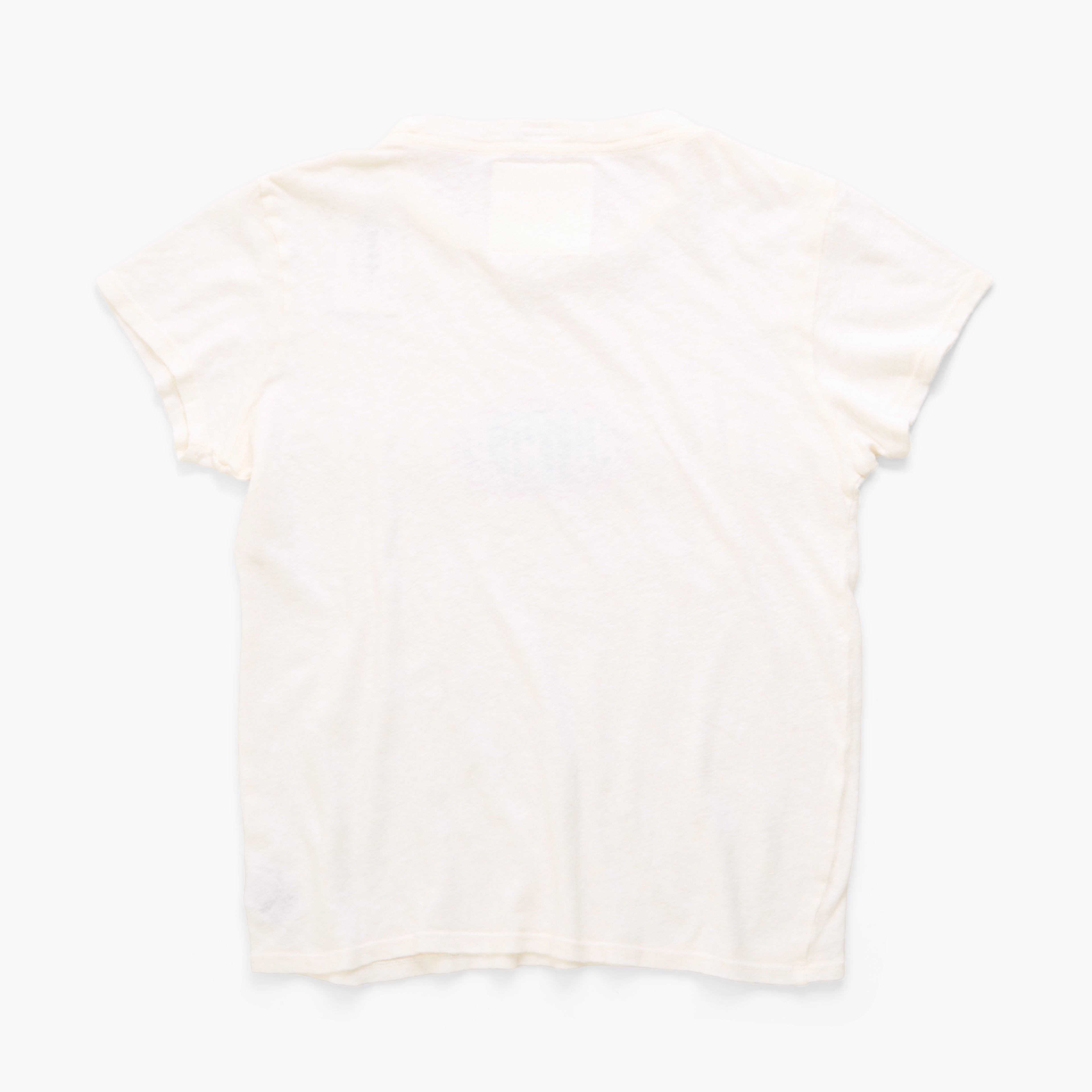 A short-sleeve crewneck t-shirt in a very pale cream or off-white color, laid flat against a clean white background.