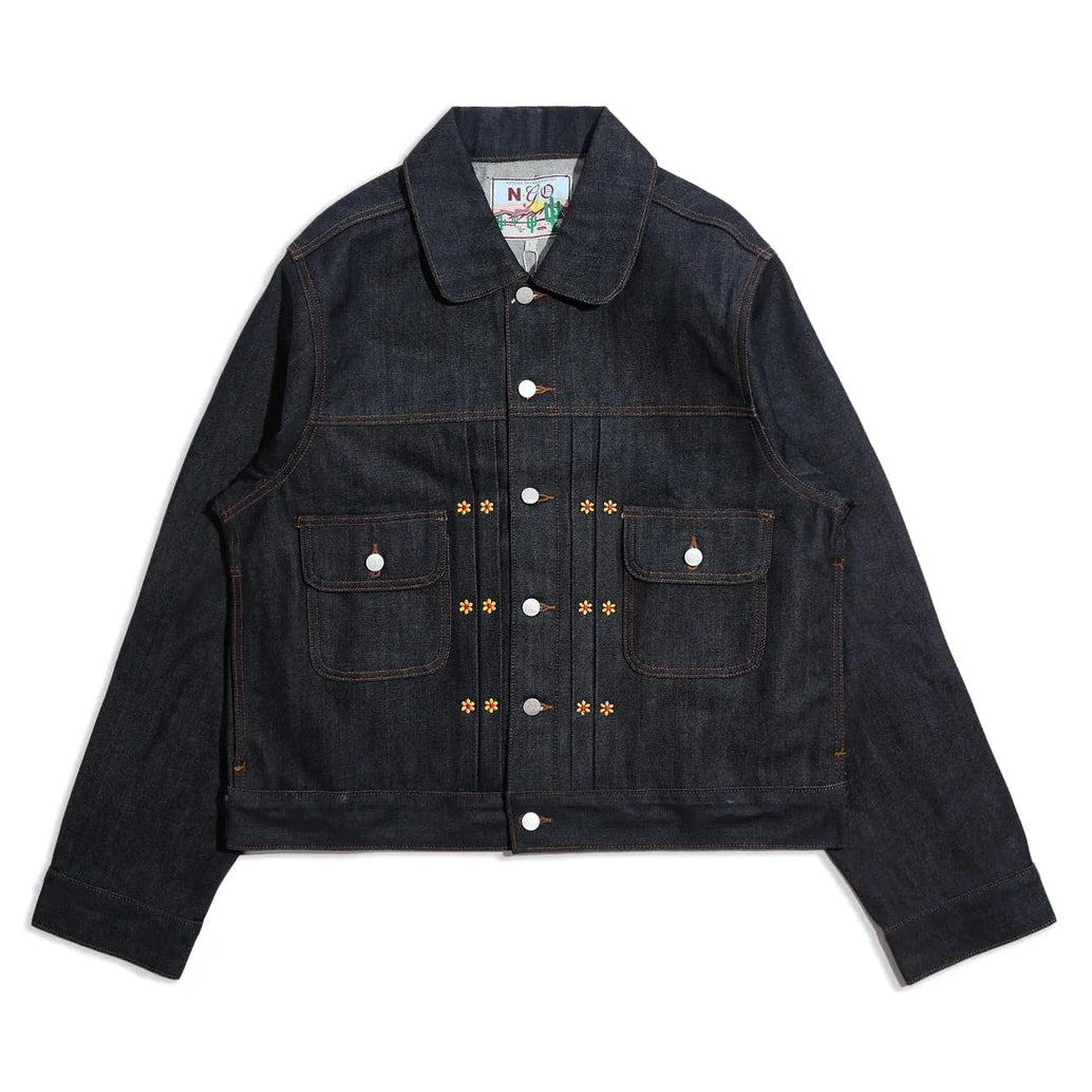 Raw indigo denim jacket on a white background