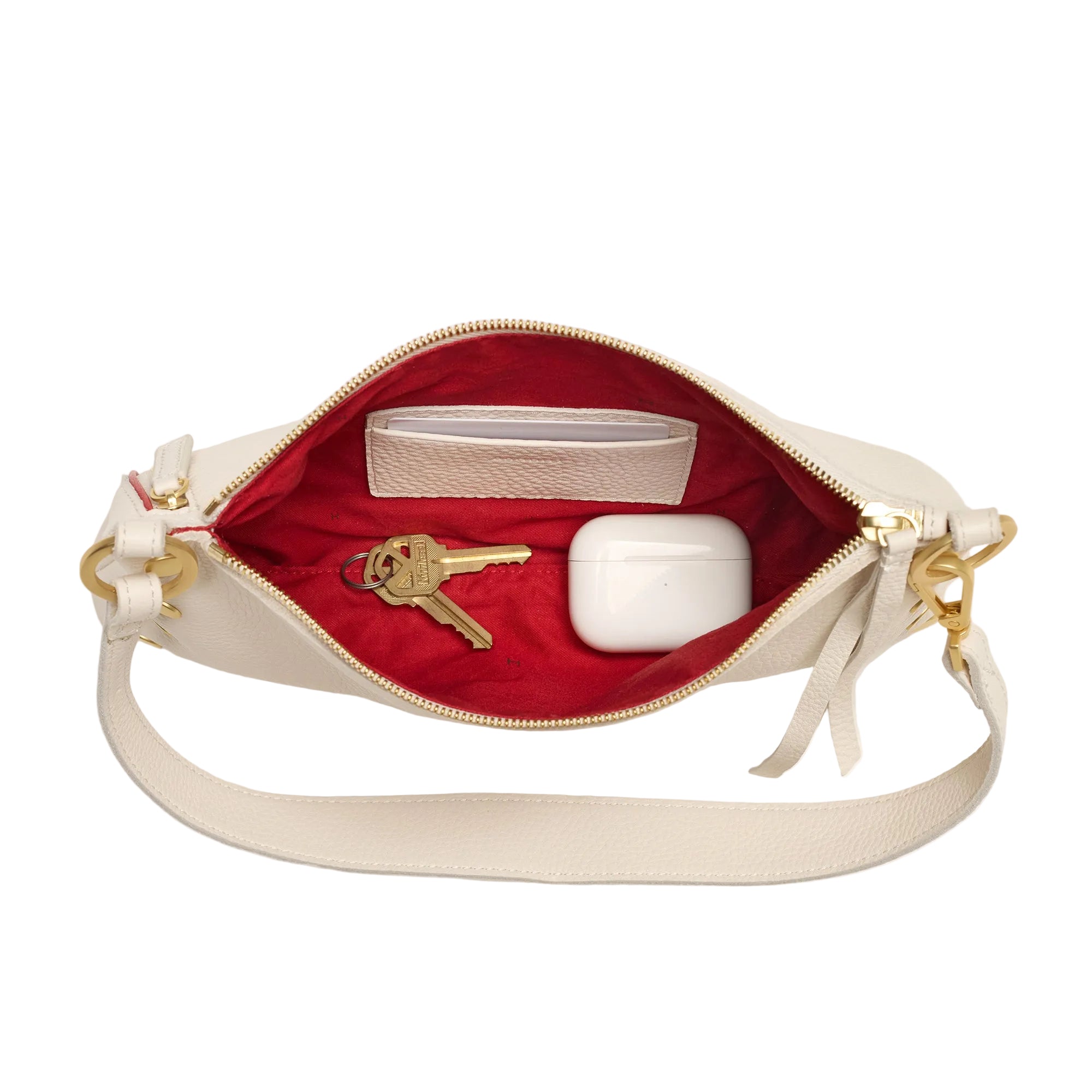 Interior view of a white leather convertible bag with gold accents on a white background