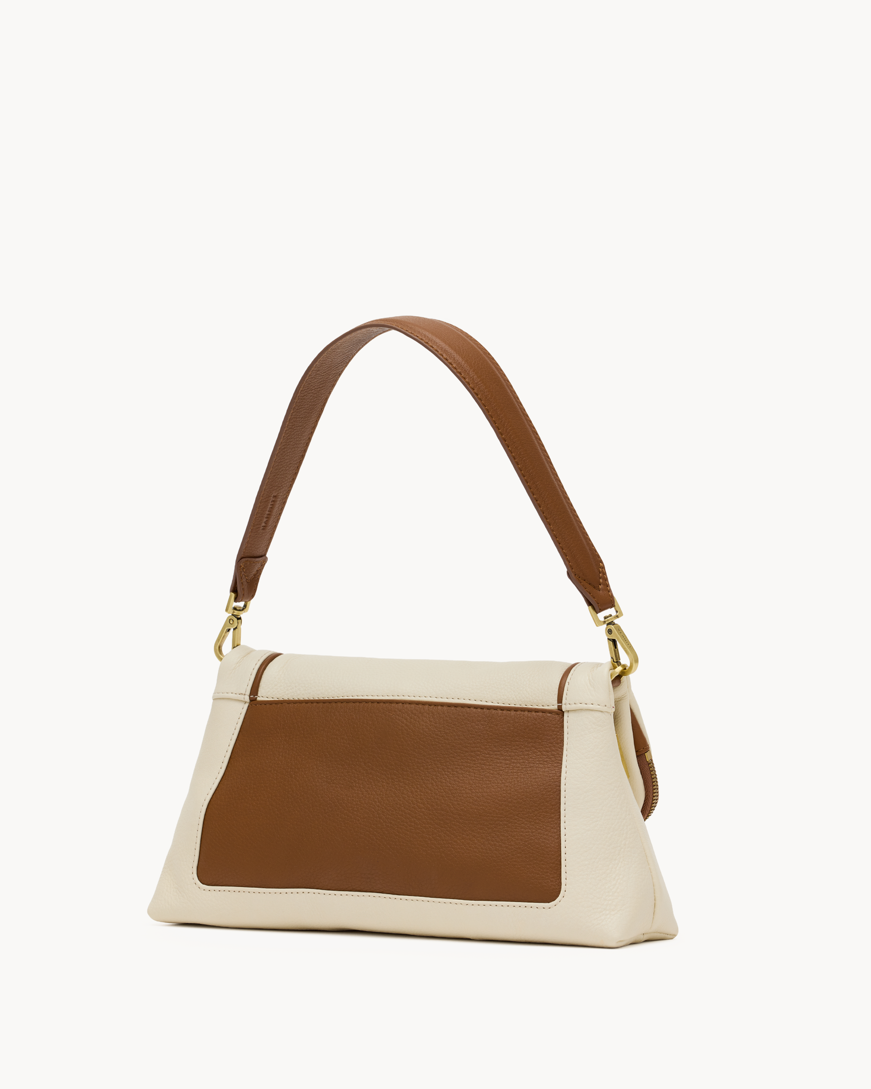 Cream purse with brown trim on a white background