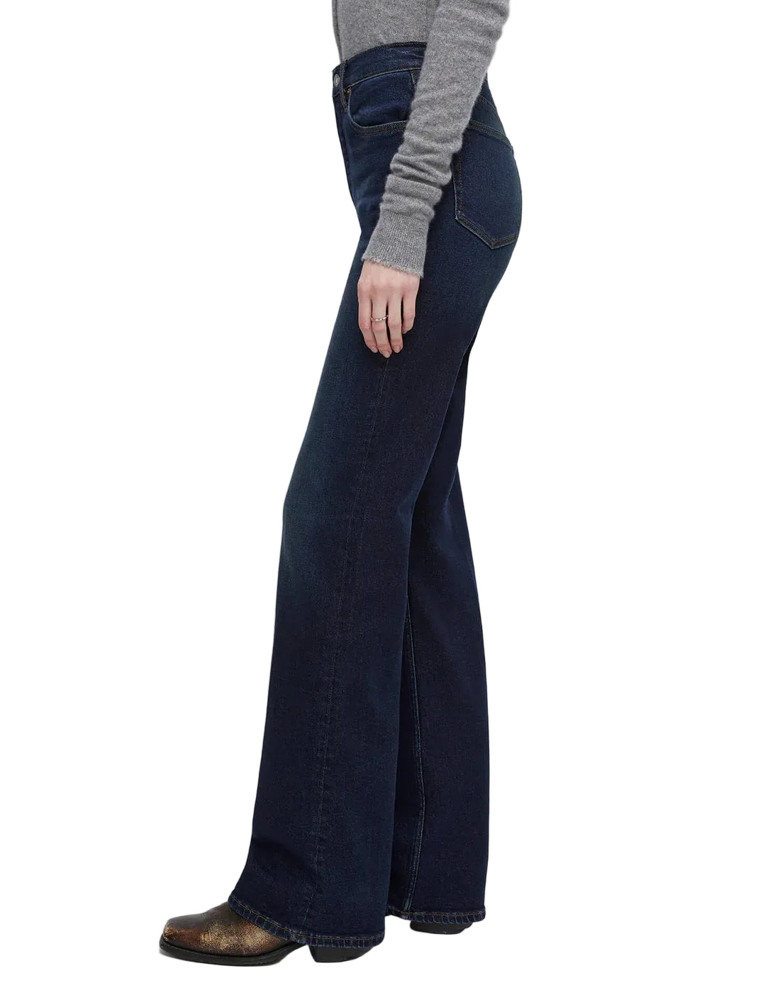Model in blue jeans on a white background