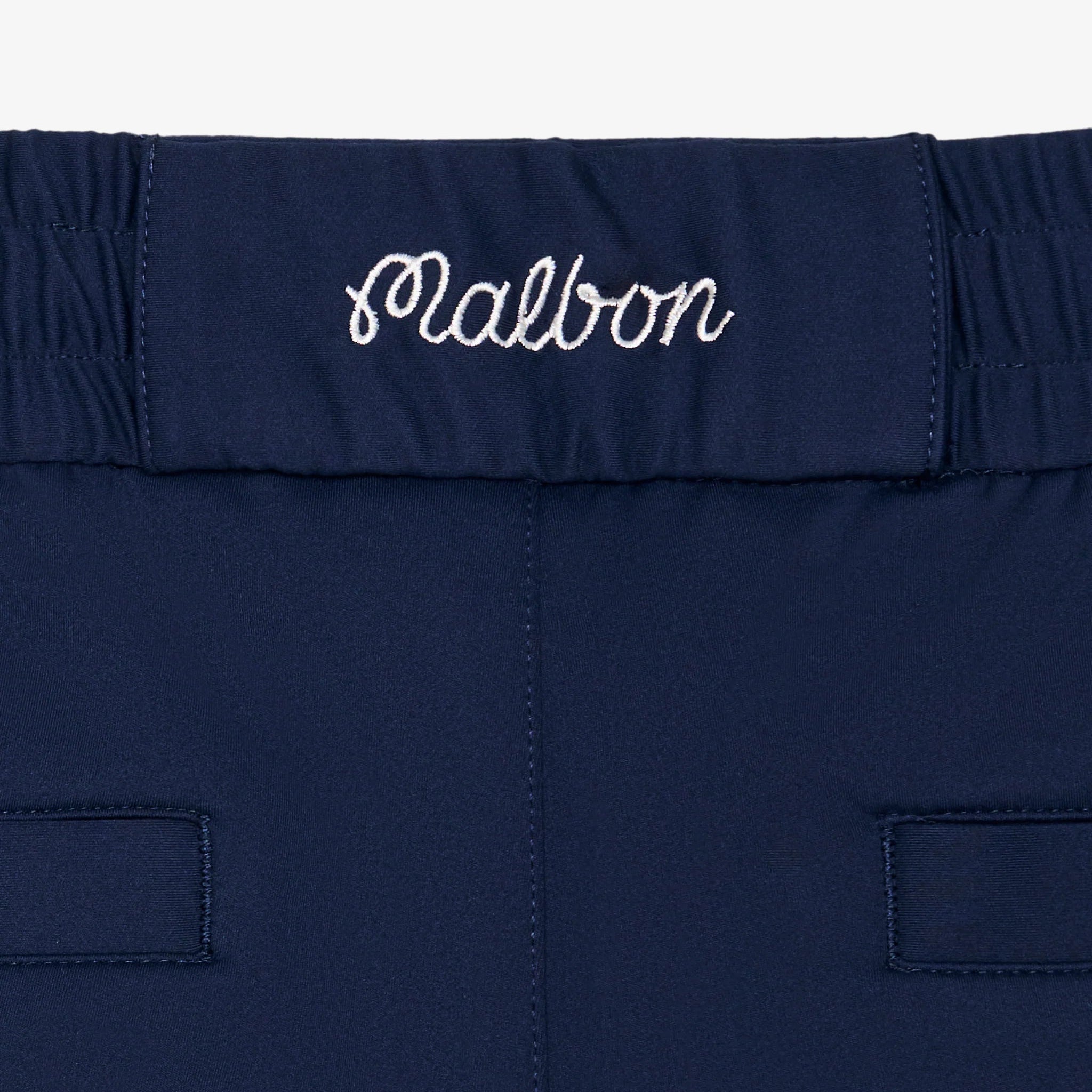 Navy blue waistband with 'Malbon' branding on a white background