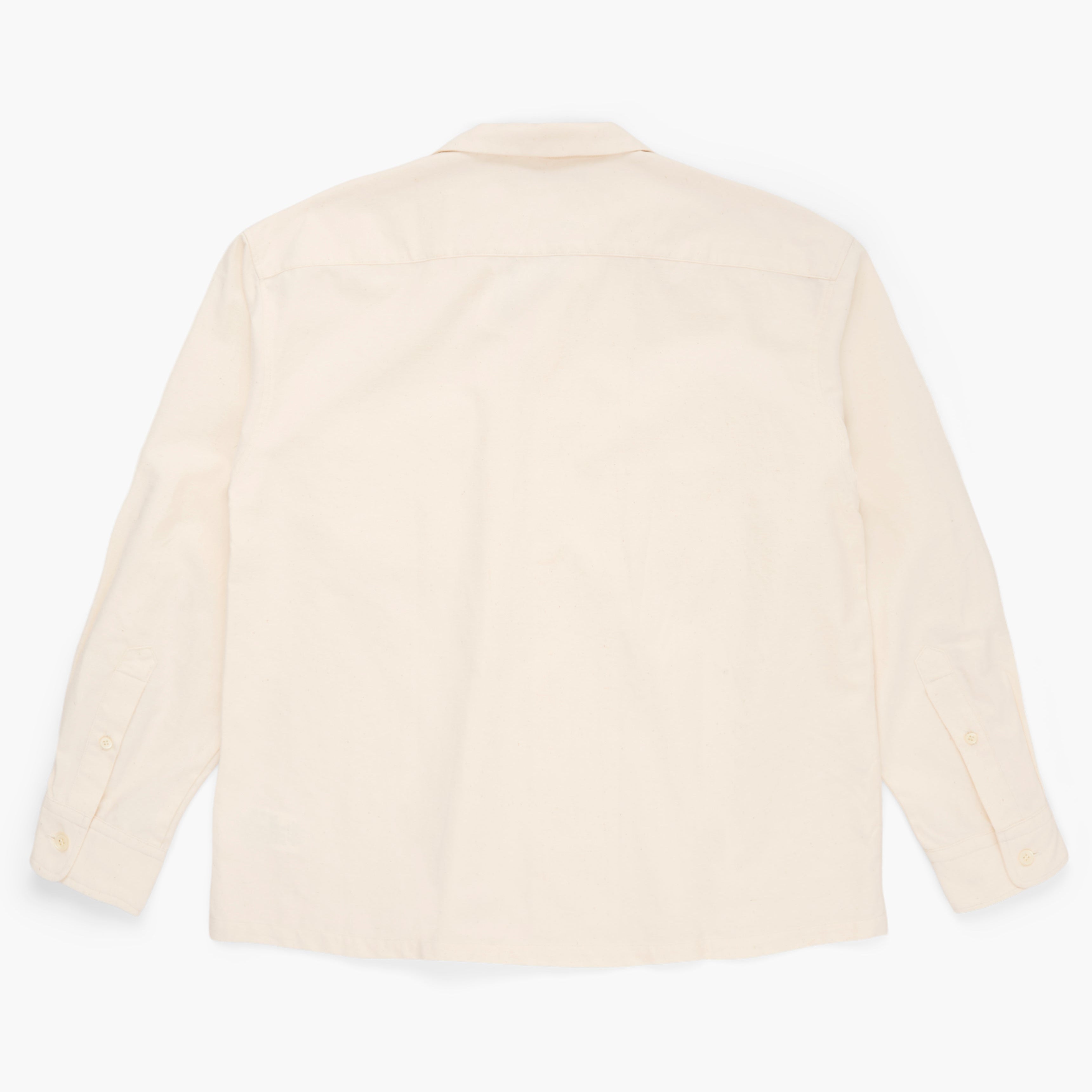 Back view of a cream button down shirt on a white background