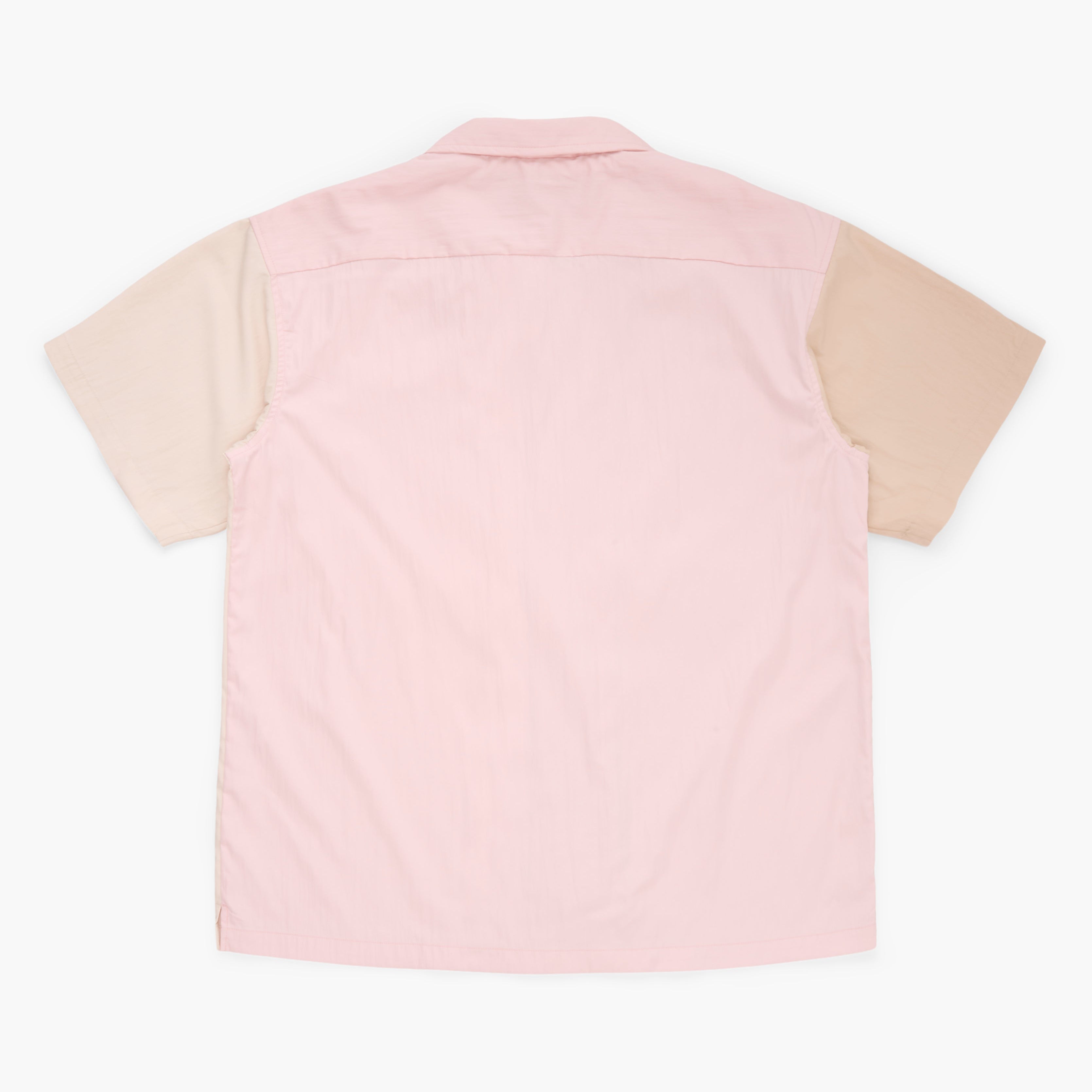 Beige, tan, and pink button down shirt on a white background