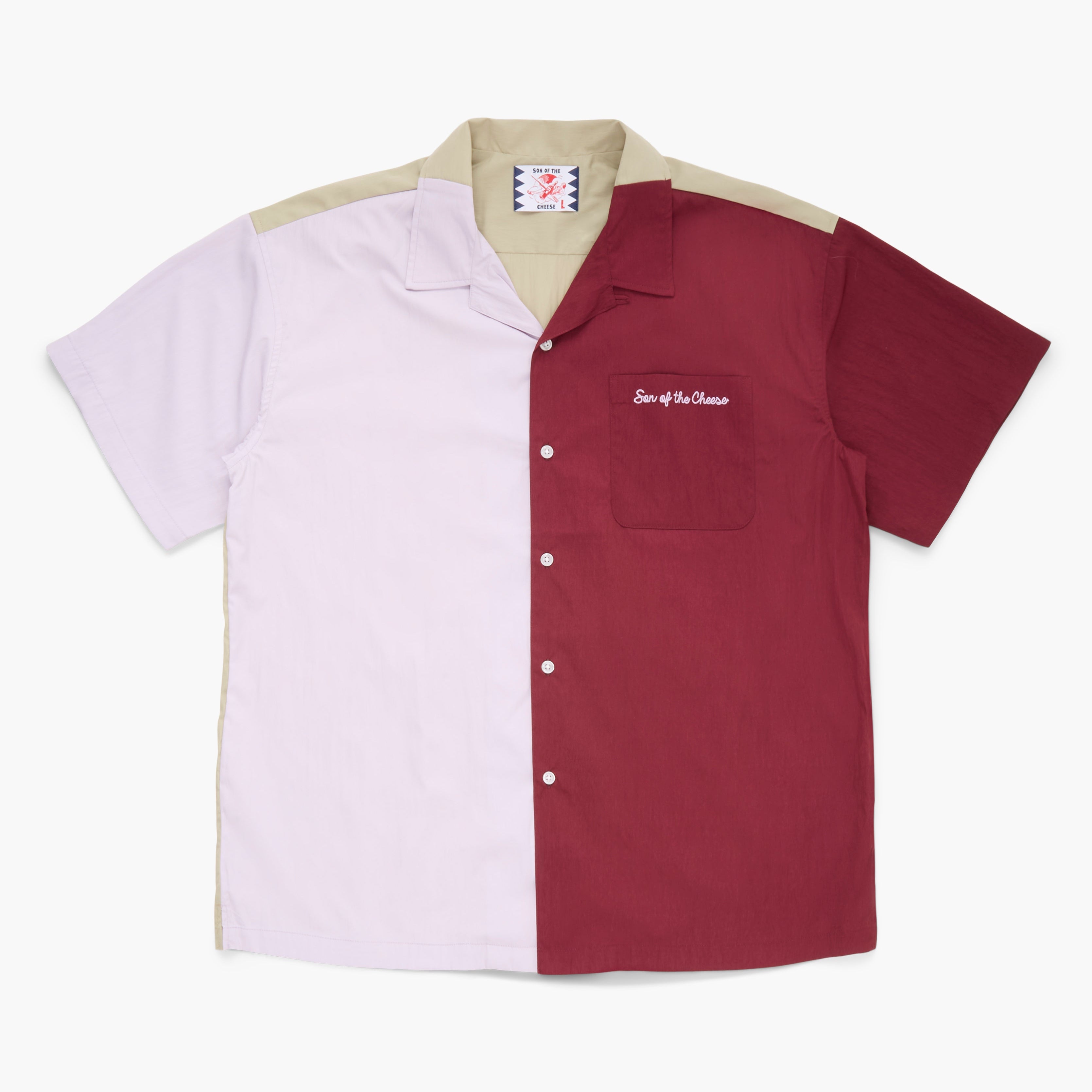 Maroon, violet, and tan short sleeved button down shirt on a white background