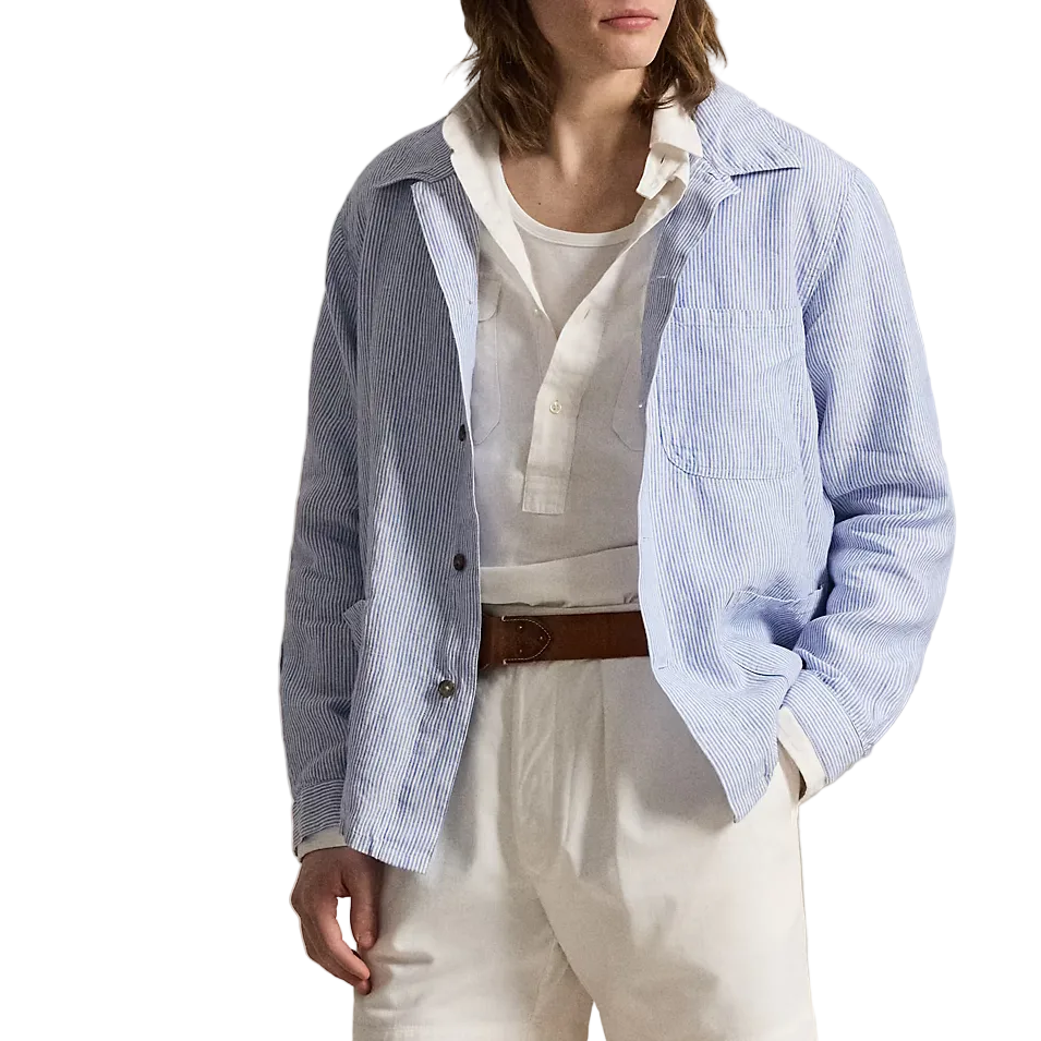 Person wearing a light blue jacket, white shirt, shorts, and cap on a white background