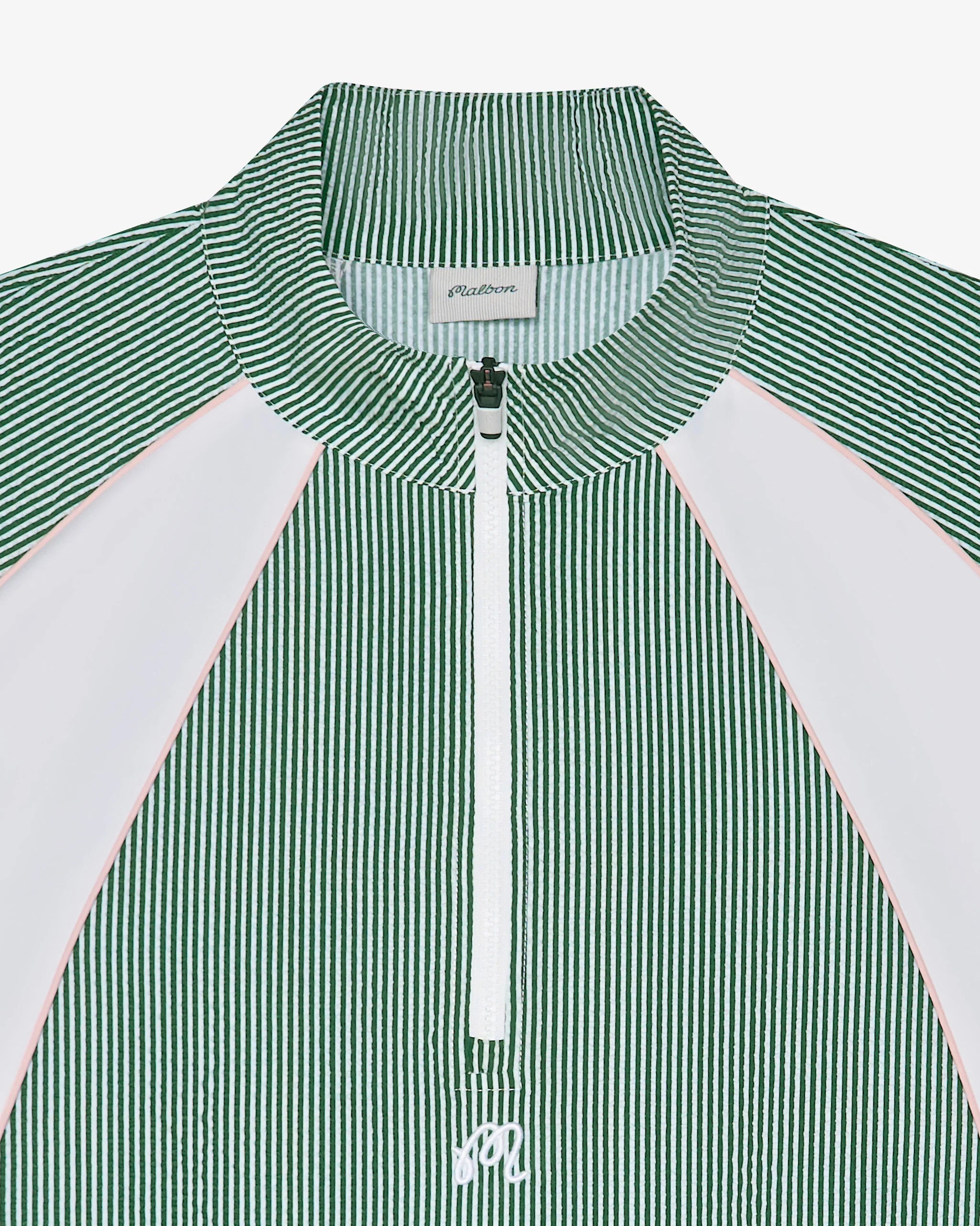 Close-up of a green seersucker pullover jacket on a white background
