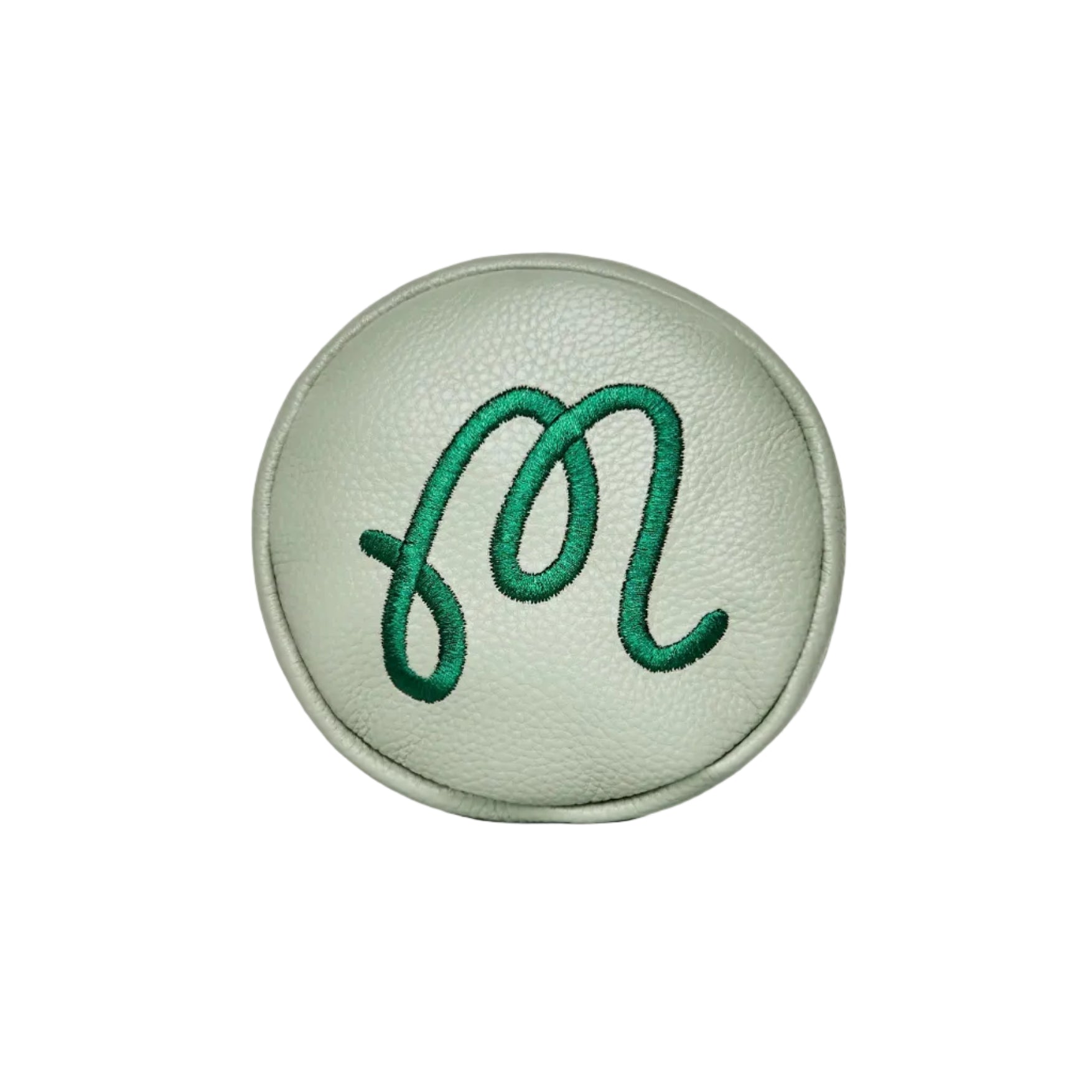 Top view of a green leather driver head cover with embroidered 'M' on a white background