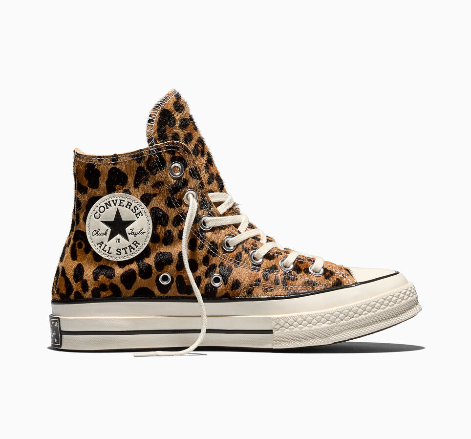 Leopard print high top Converse on a white background