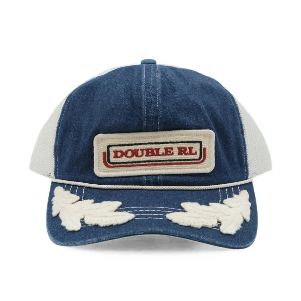 A blue denim trucker hat with white mesh back panels, featuring a rectangular 'DOUBLE RL' brand patch on the front and distressed white embroidery on the brim.