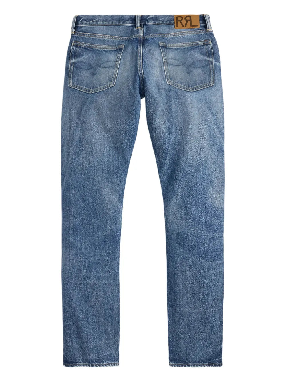 Back view of a pair of medium-wash blue denim jeans with a brown leather patch featuring the letters 'RRL ' on the back waistband, shown against a plain white background.