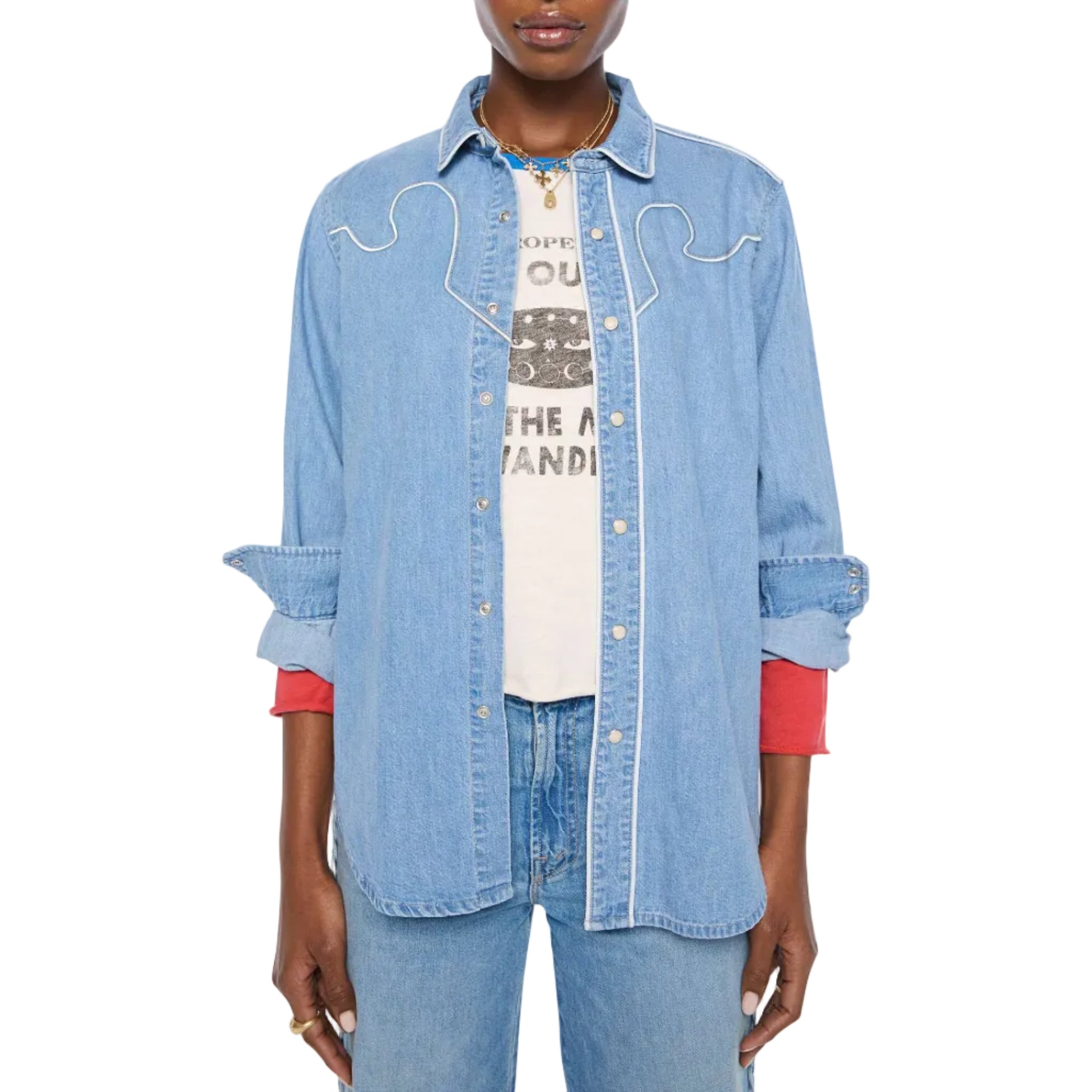 A model wearing a light blue denim western-style shirt over a white graphic tee and light blue jeans, against a plain white background.