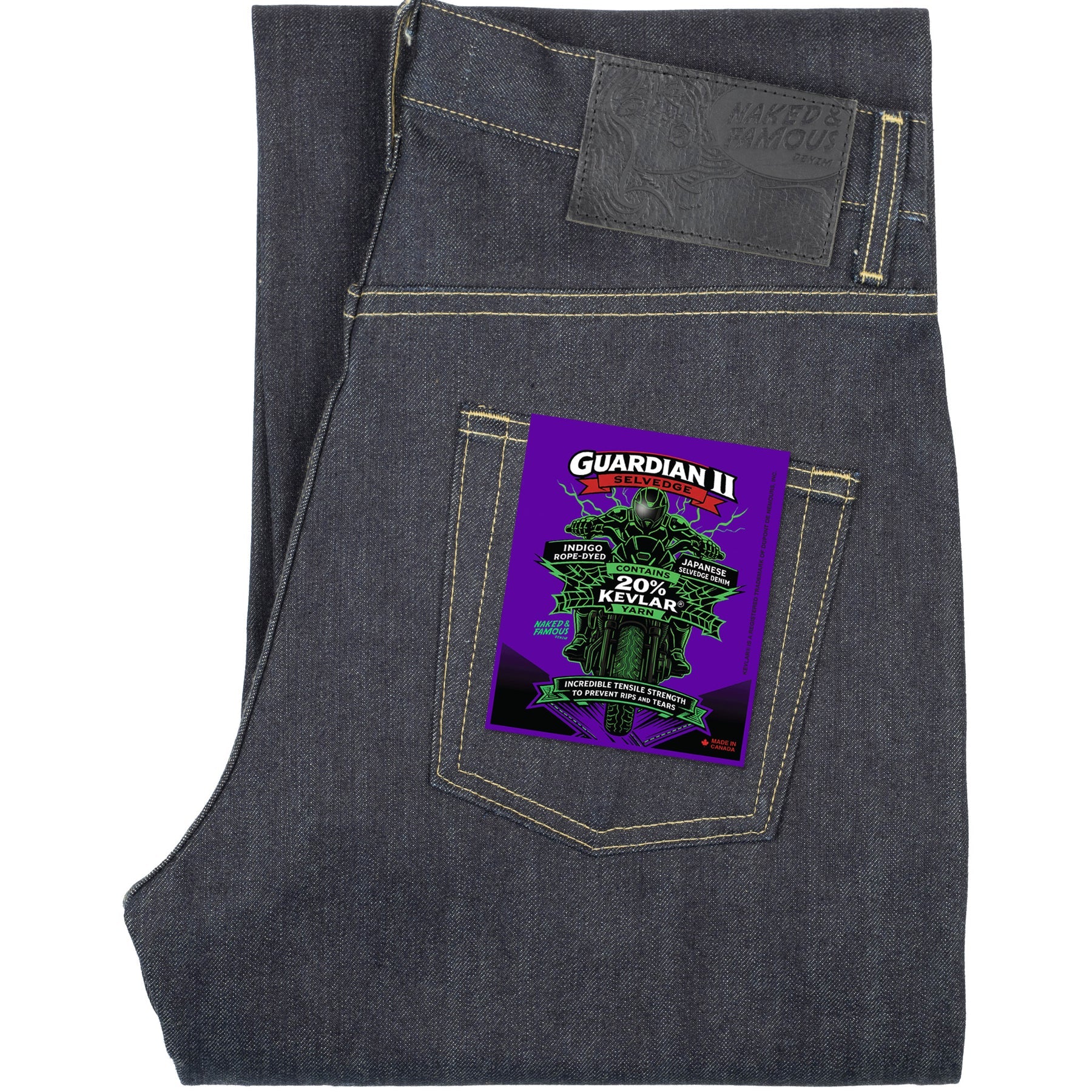 Dark gray indigo jeans folded to show the back pocket area, featuring a purple Guardian II patch on the pocket.