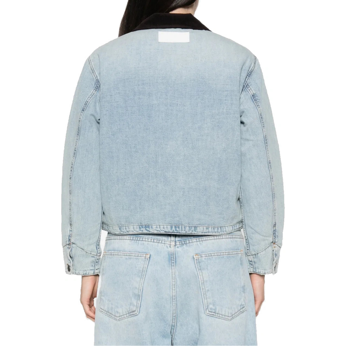Back view of the Canyon Jacket on a model, showing the cropped hem, the brown corduroy collar and a label patch below the collar.
