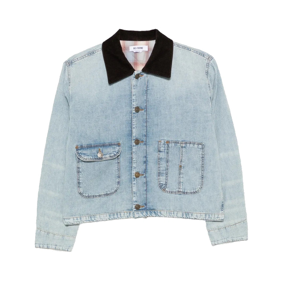 RE/DONE Canyon Jacket laid flat. It’s a cropped, light-wash denim jacket with a dark brown corduroy collar, metal buttons and two patch pockets.