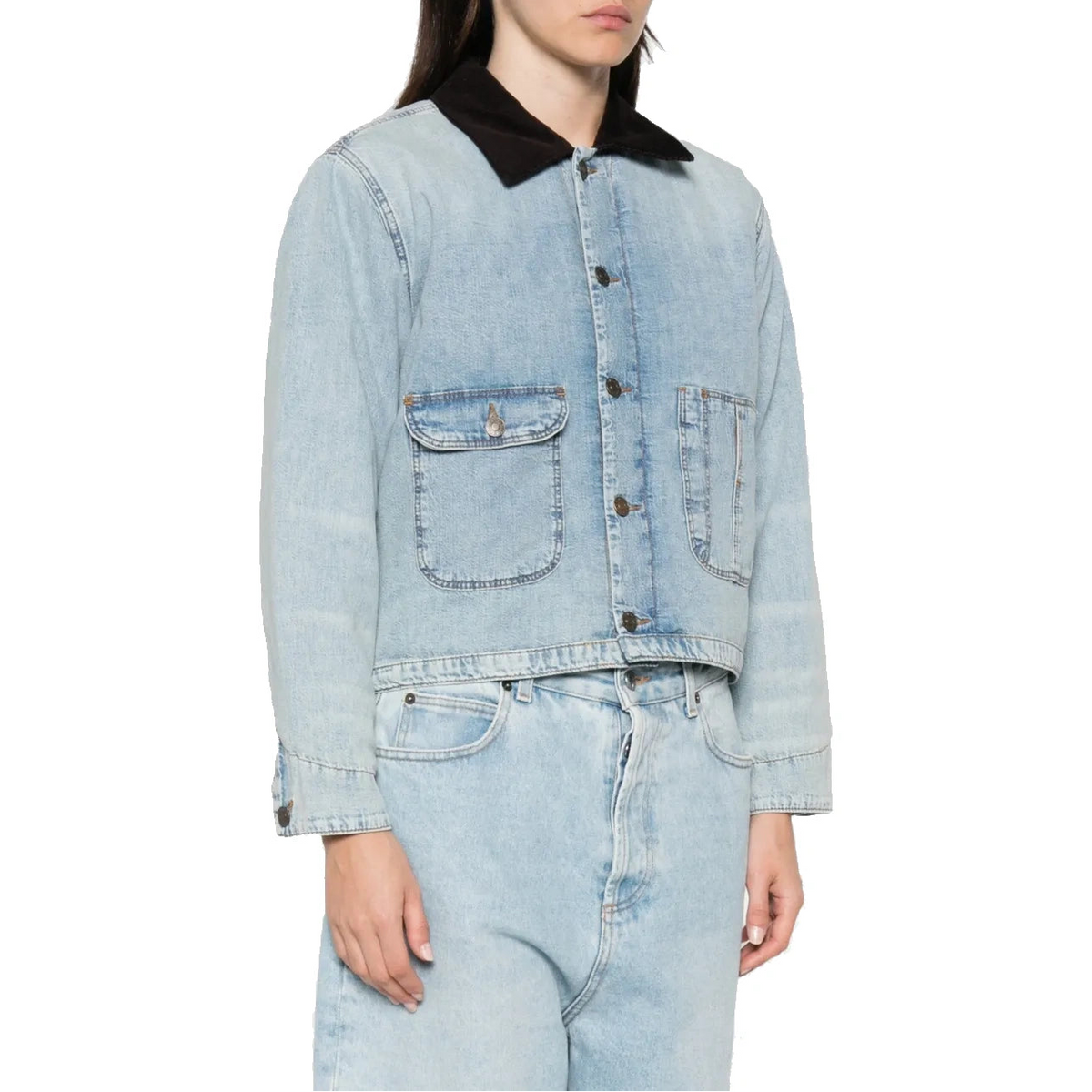 A model wears the Canyon Jacket buttoned, with light-wash jeans, seen from a three-quarter angle.