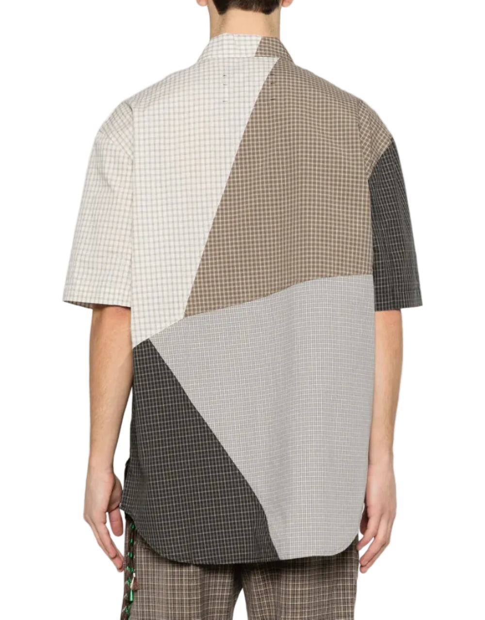 Person in a short sleeved button down shirt in multi-colorblock check on a white background. Back view
