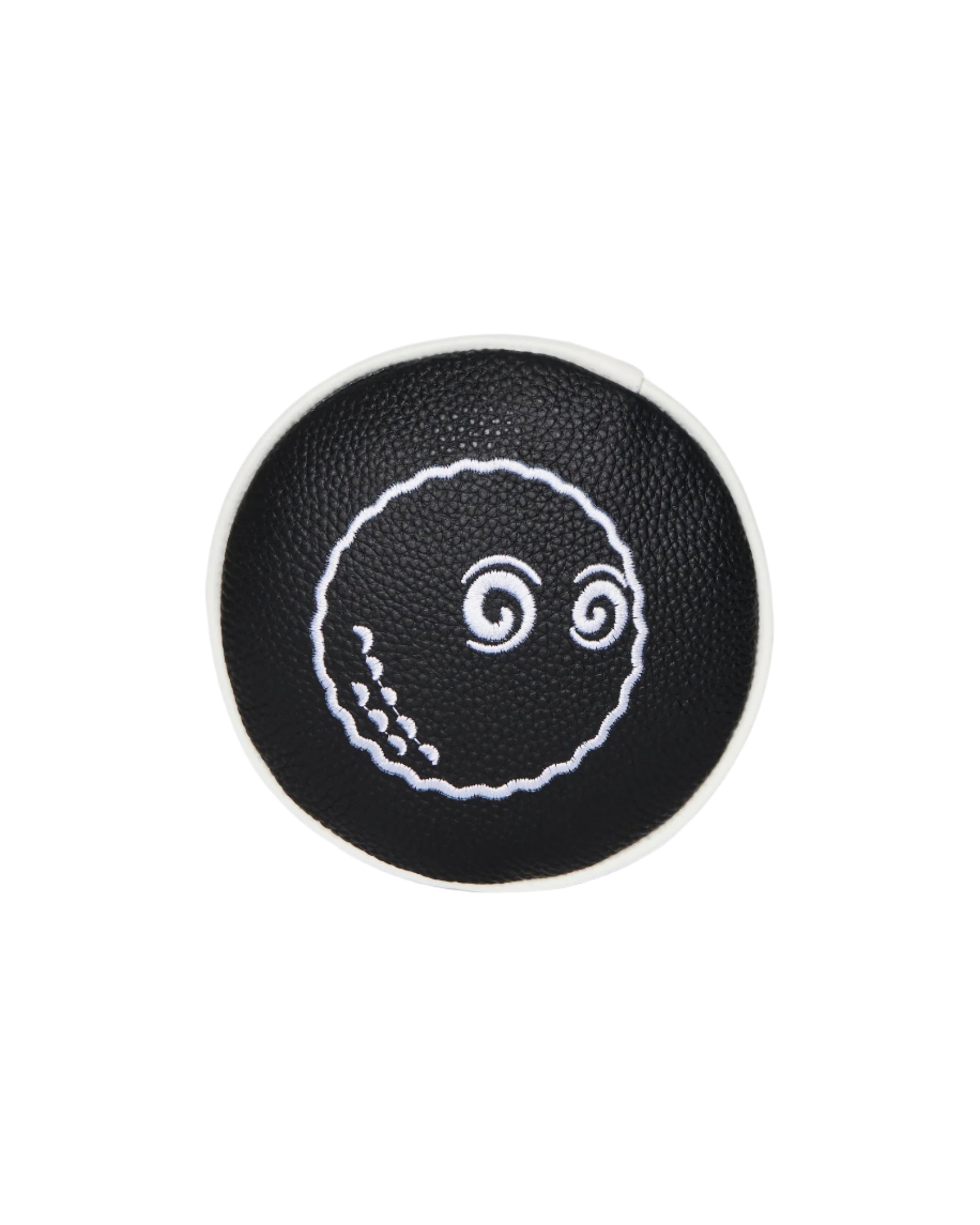 Black round coaster with white octopus design on a white background
