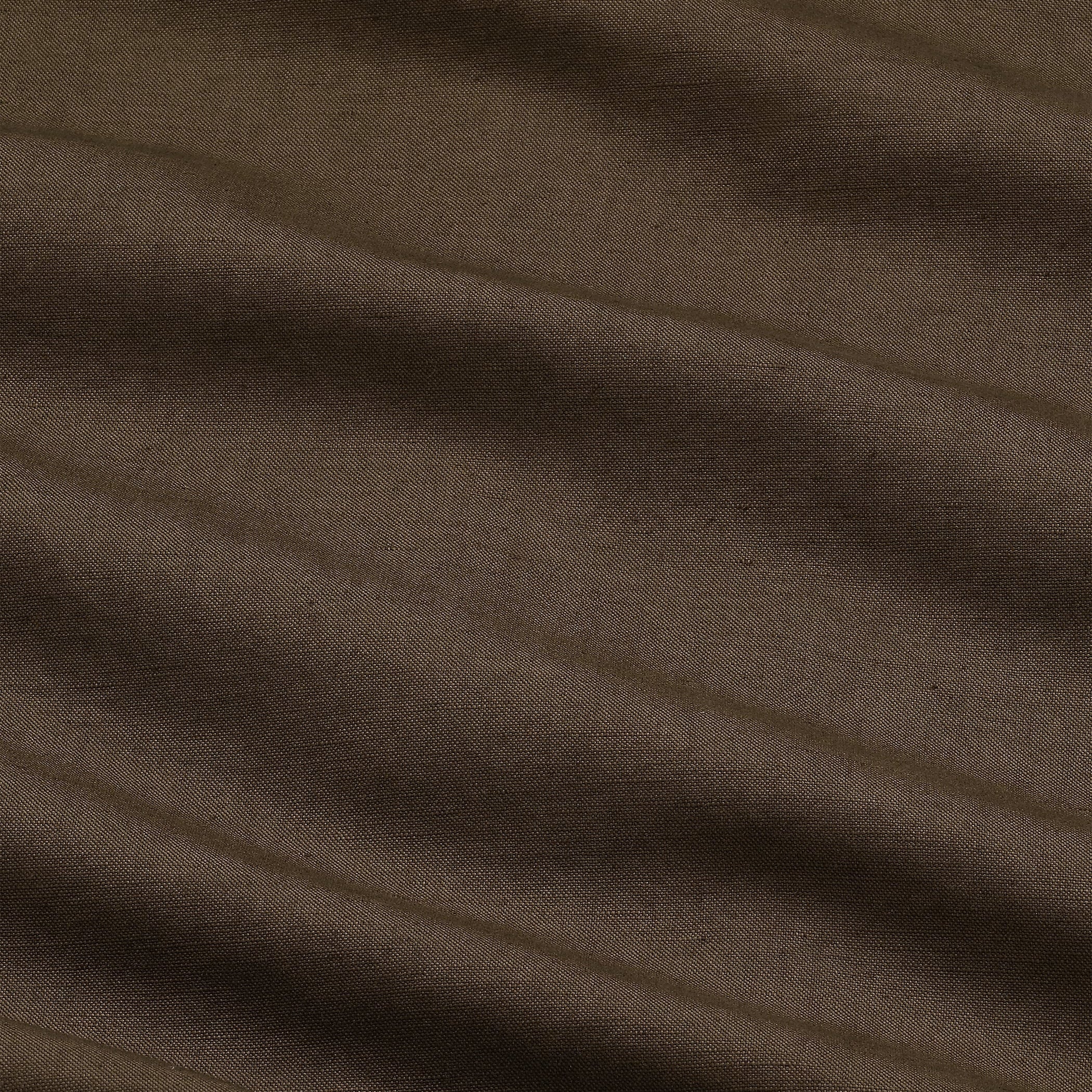 Close-up of brown fabric with visible texture and folds