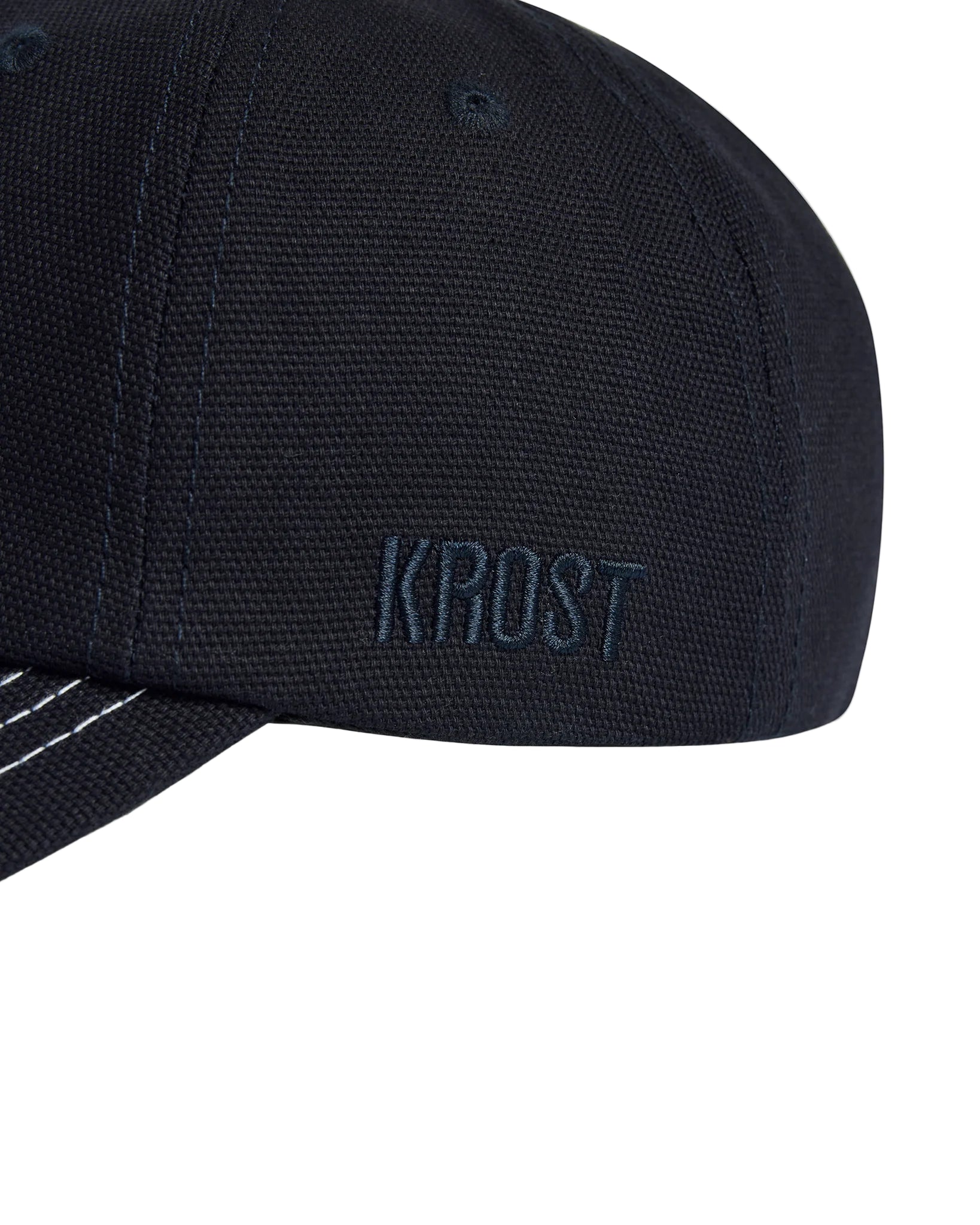 navy cap with 'KROST' branding on a white background