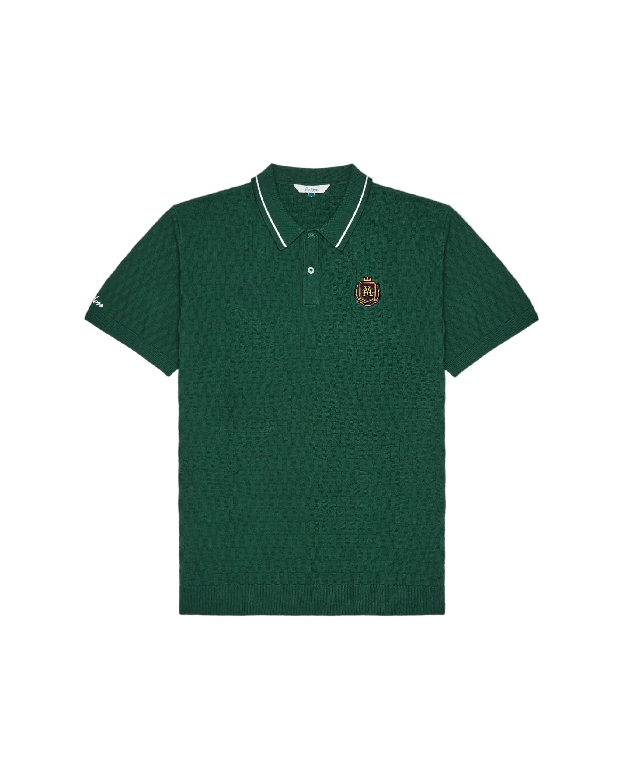 Green polo on a white background