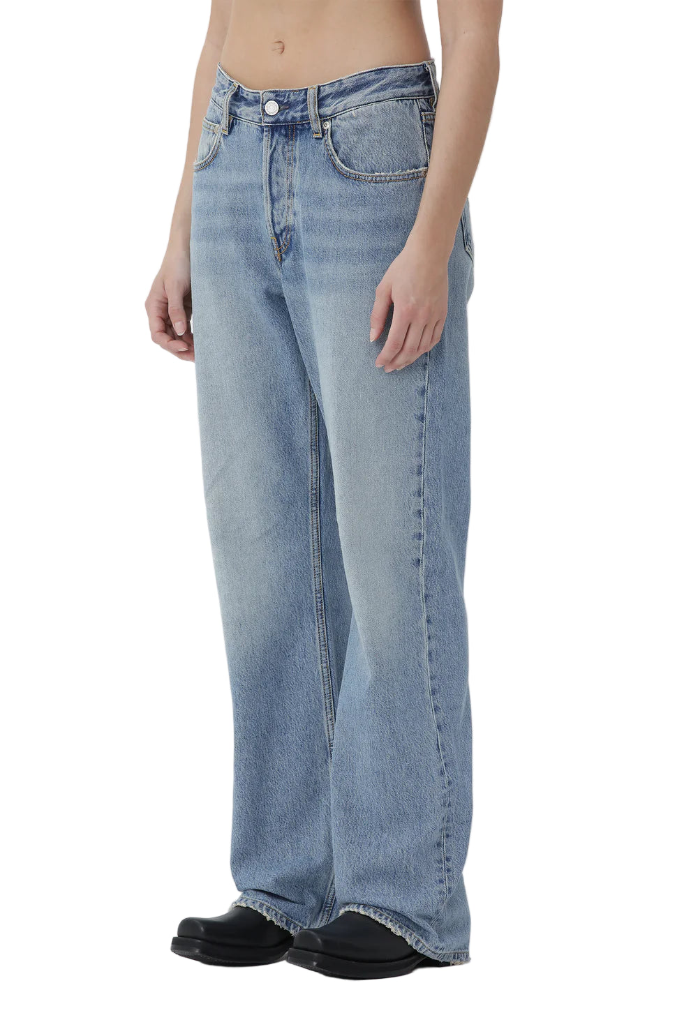 Light blue jeans worn by a person on a white background