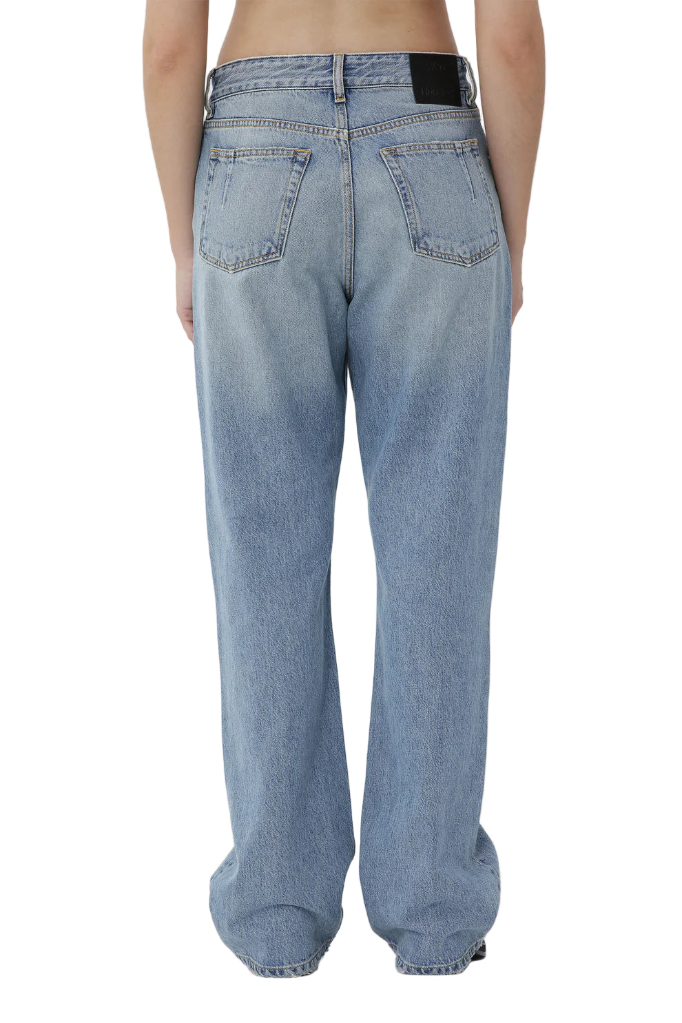 Light blue jeans worn by a person on a white background