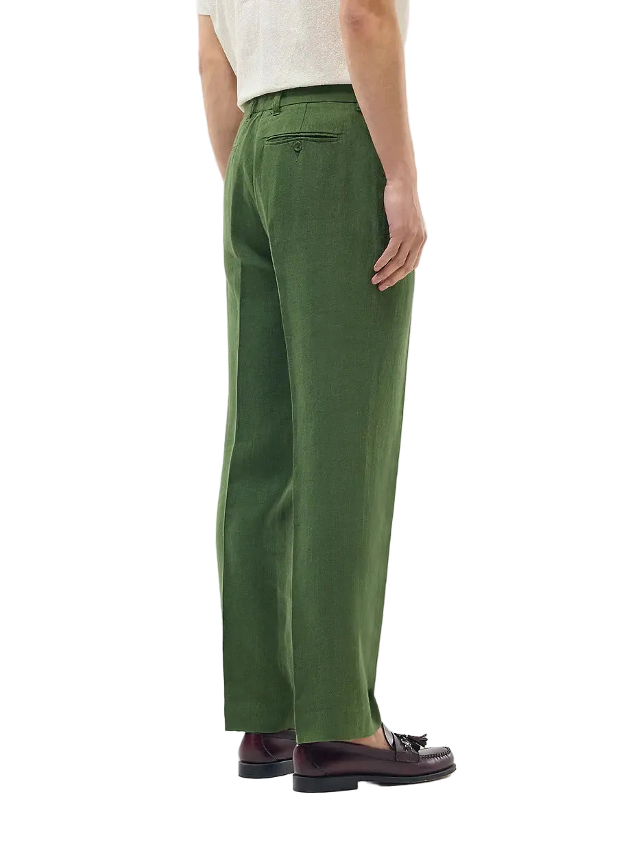 Person wearing green pants on a white background