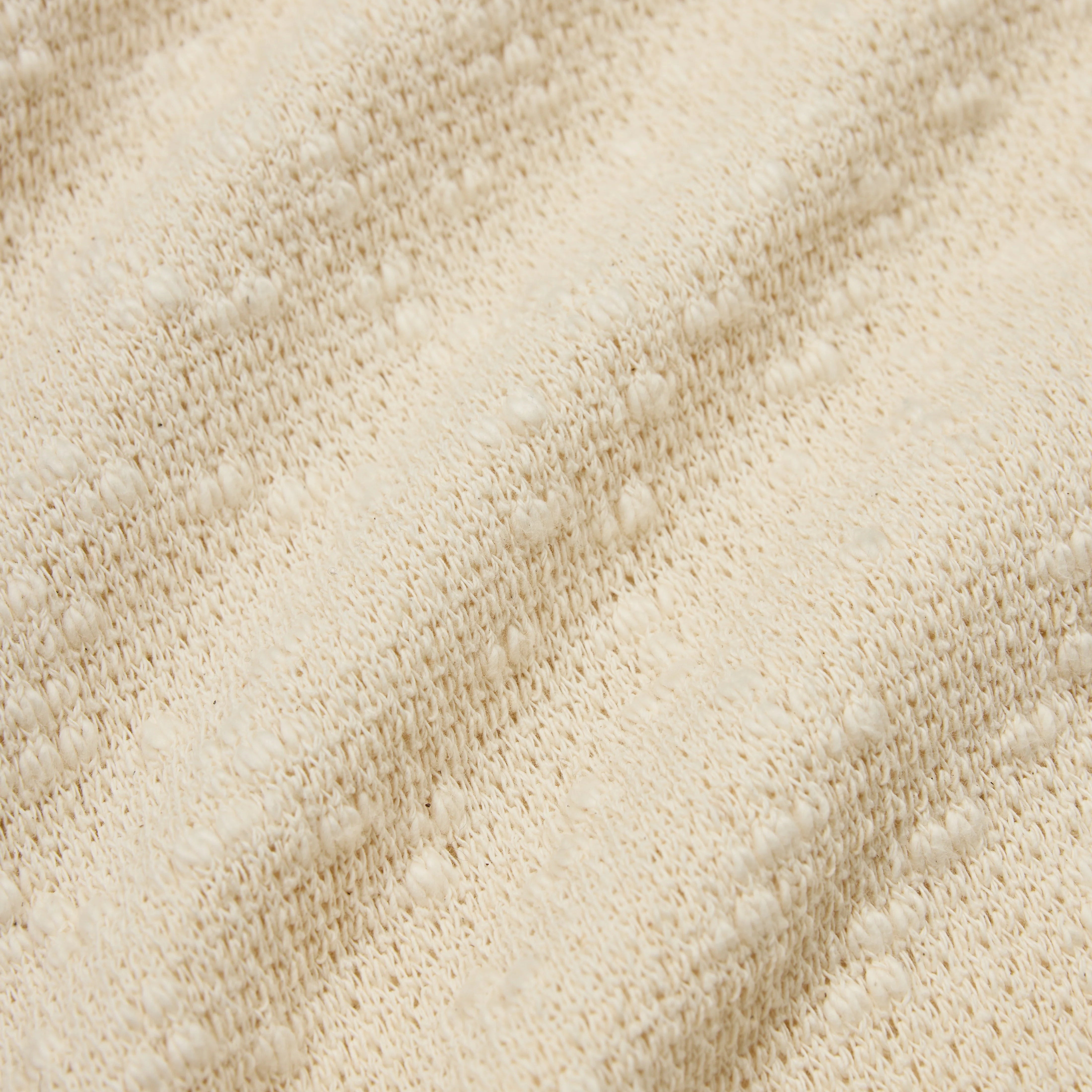 Close-up of beige textured fabric