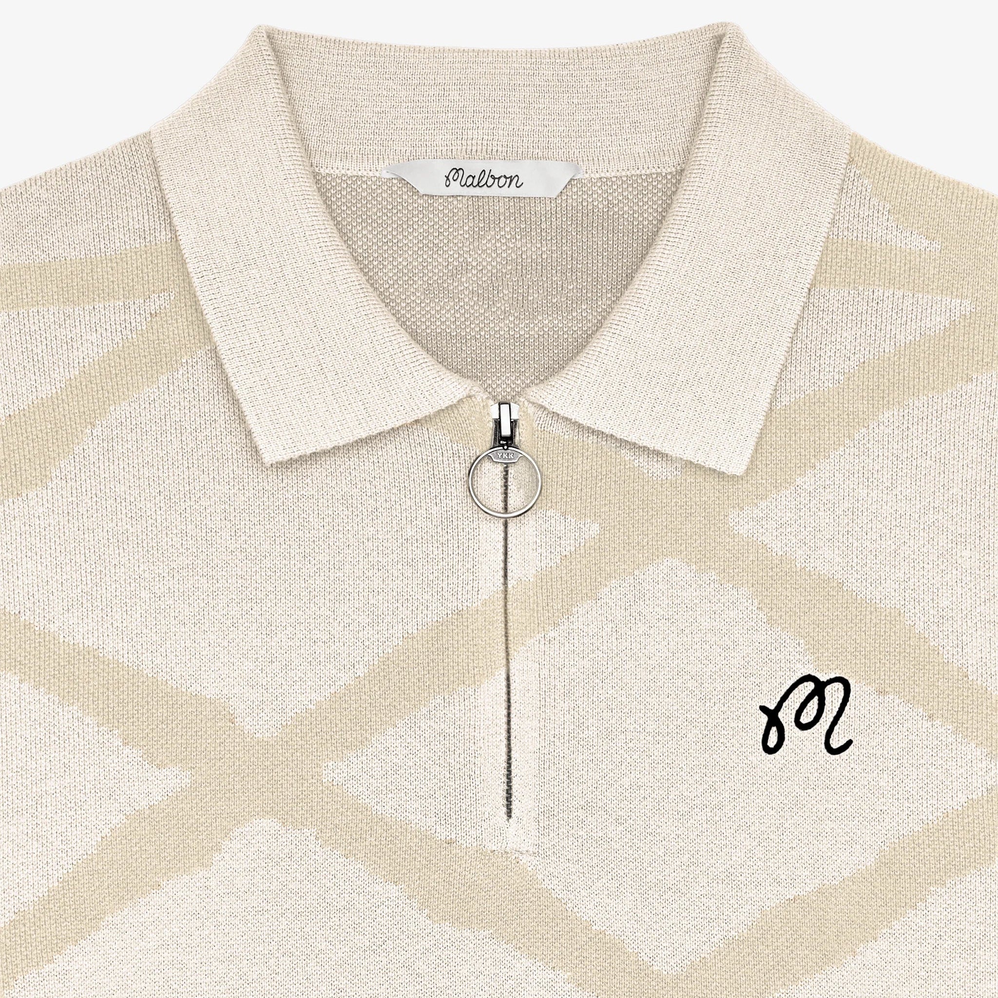 Beige patterned polo shirt with a collar and monogram on a white background