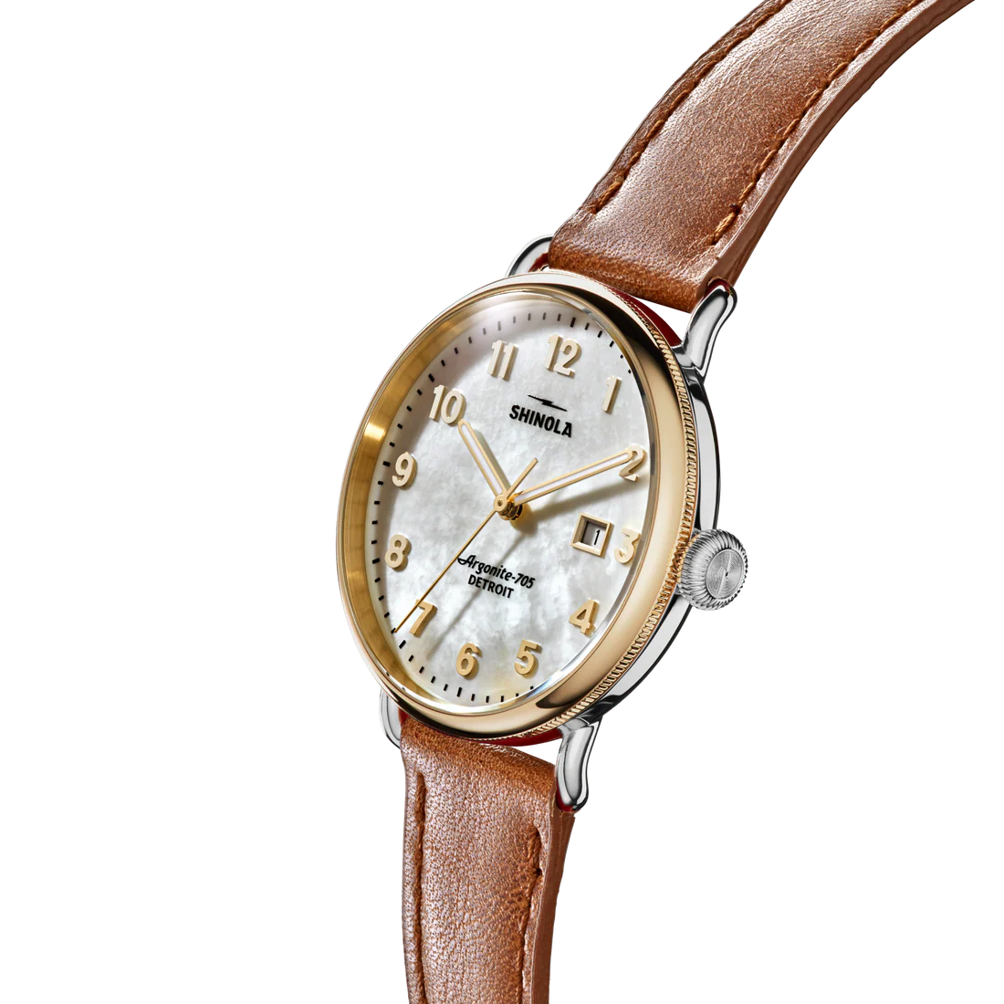 Shinola watch with brown leather strap and gold casing on white background