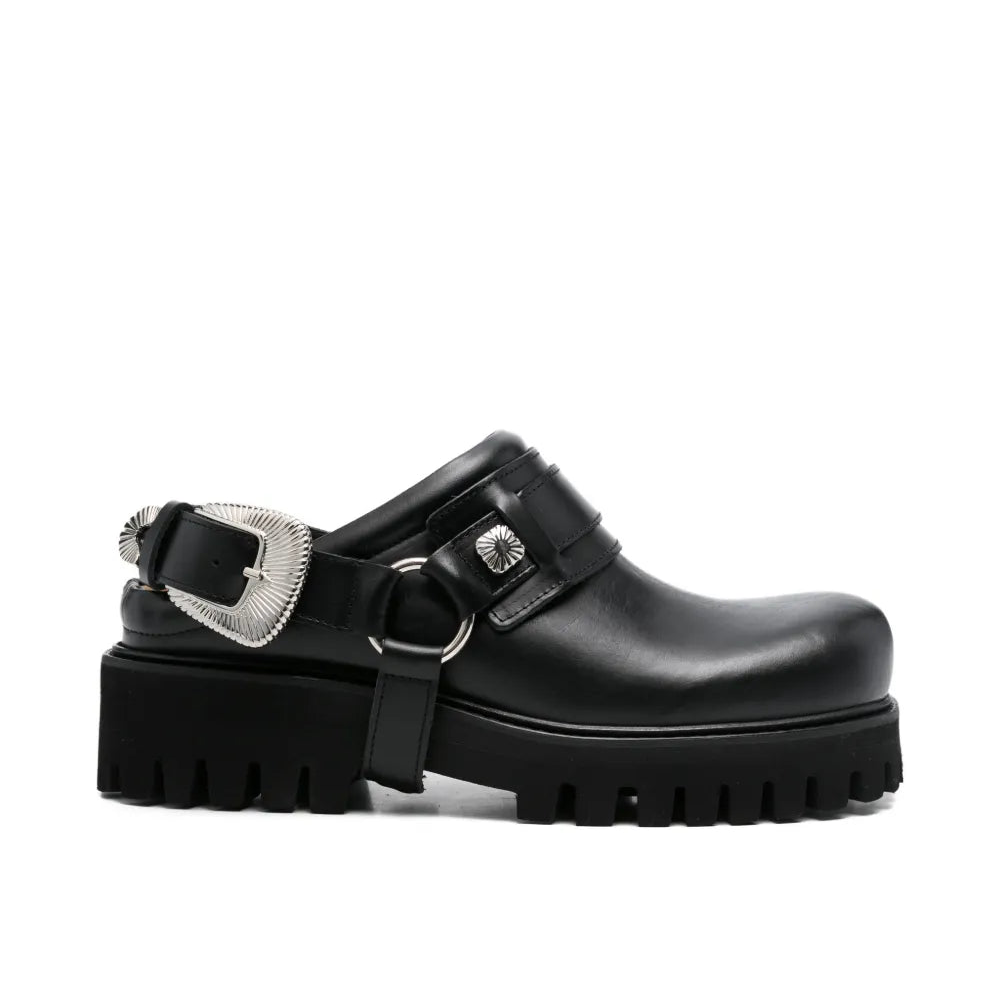 Black mule shoe on a white background