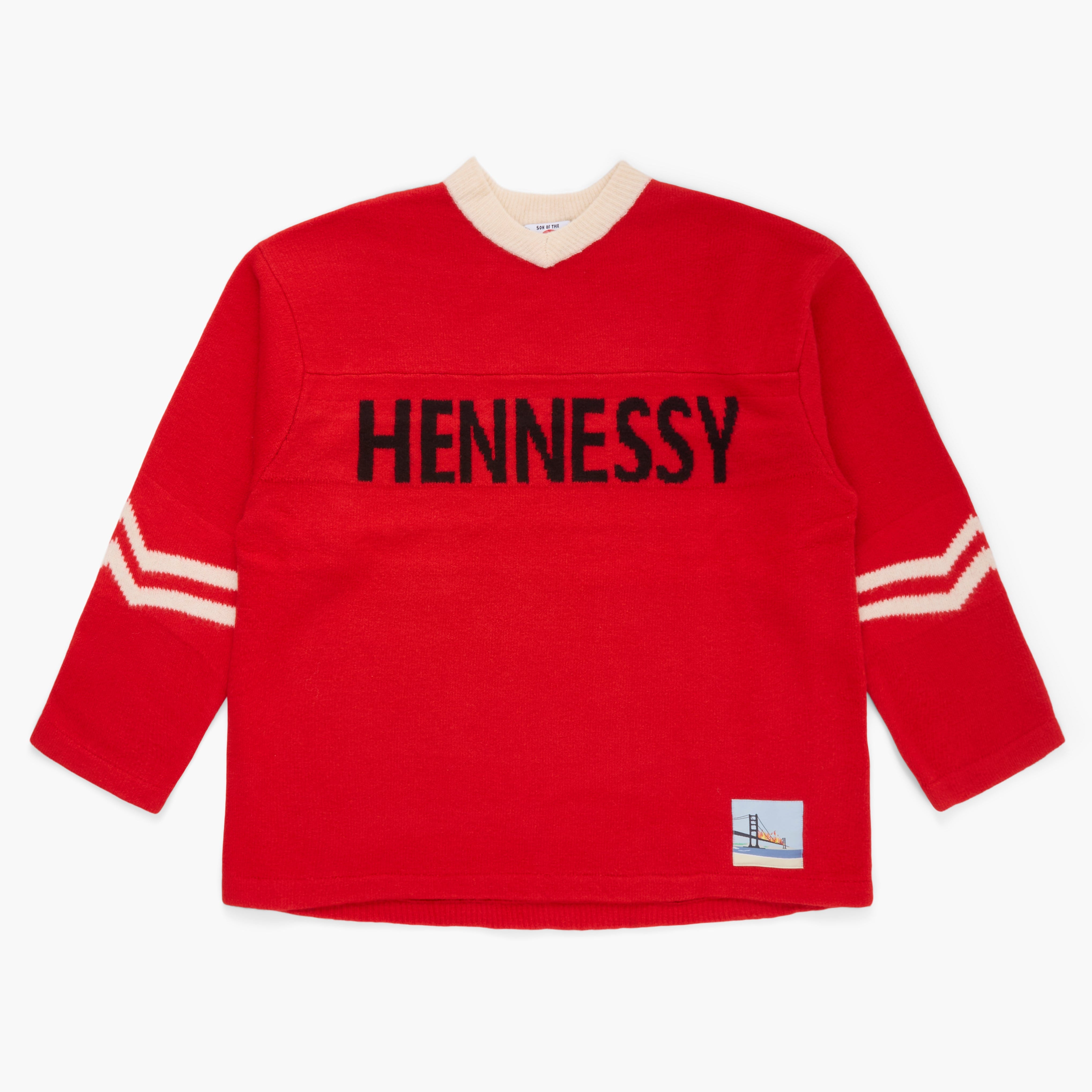 Red sweater with 'Hennessy' knit at the front on a white background