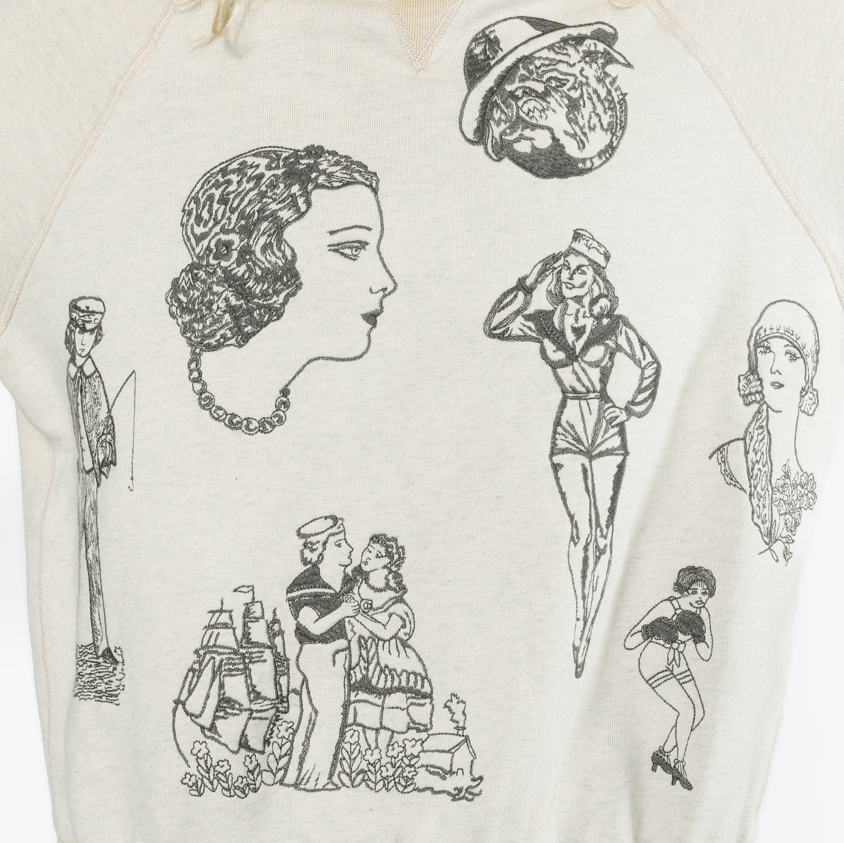 An off-white heathered sweatshirt featuring black vintage-style line art illustrations of women, men, and a hat on the front.