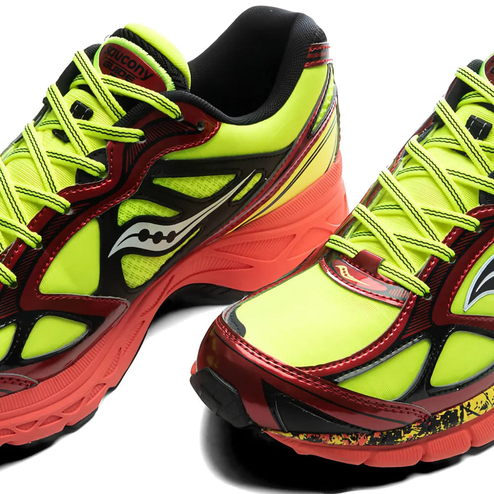 Saucony Progrid Guide 7 men's running shoes in bright canary yellow with red accents, angled view