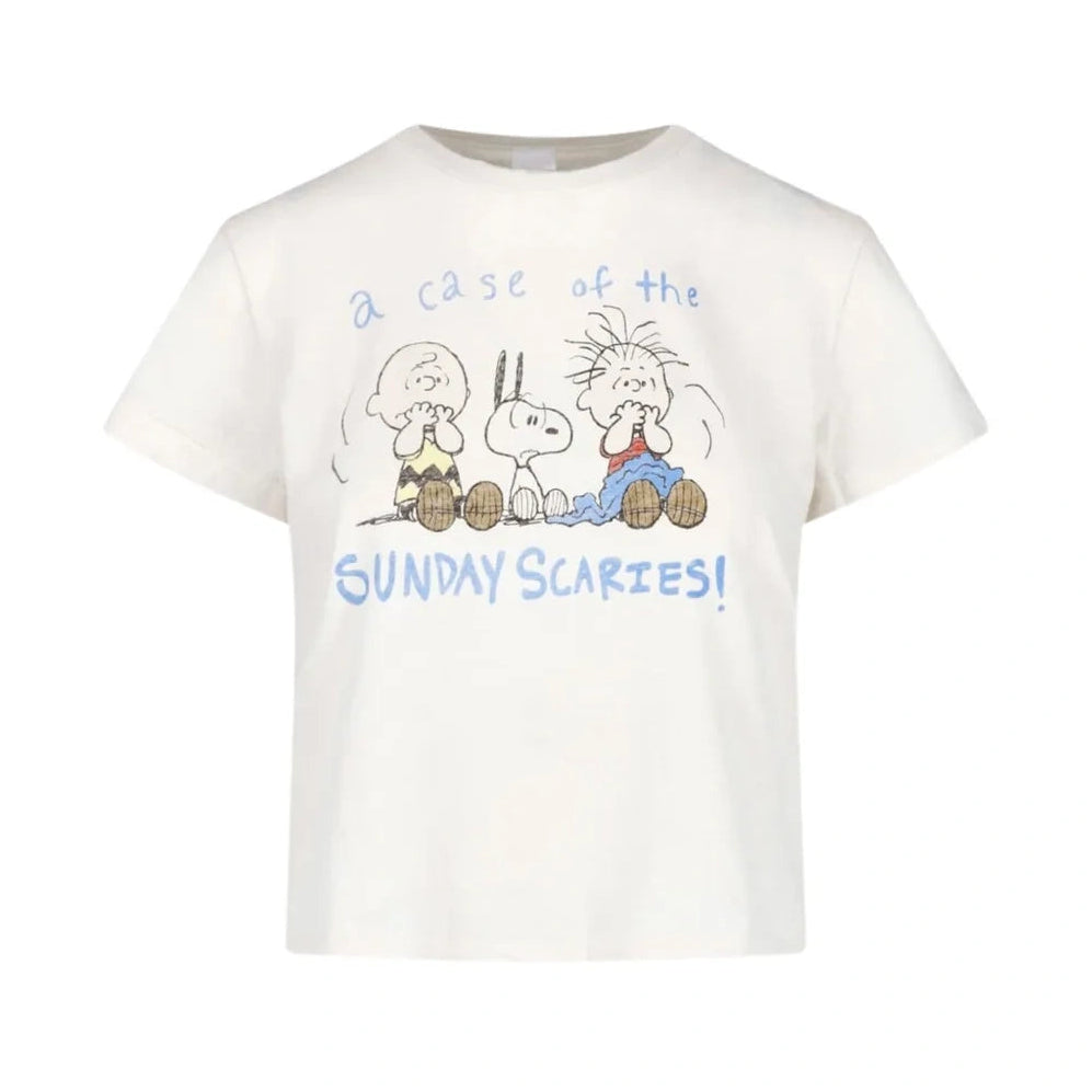 An off-white short-sleeve t-shirt featuring a Peanuts graphic of Charlie Brown, Snoopy, and Woodstock with the text 'a case of the SUNDAY SCARIES!' printed in blue and brown.