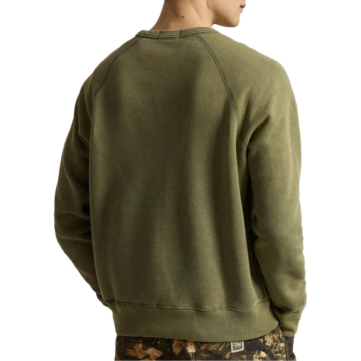Back view of the olive Red Rock Crewneck on a model, showing the raglan sleeves and ribbed hem.