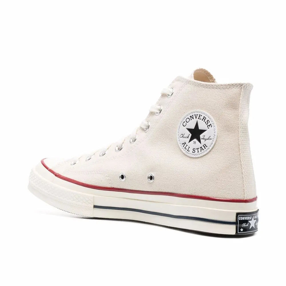 White canvas hi-top sneaker on a white background