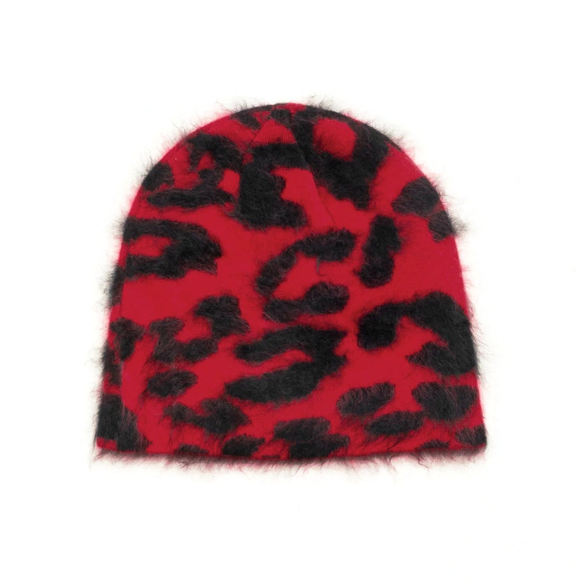 A fuzzy knit beanie hat featuring a bold black leopard print pattern on a vibrant red background, isolated on a solid white background.