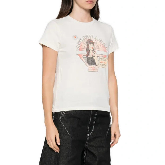 A model wearing a white graphic t-shirt and black wide-leg jeans, standing against a plain white background.