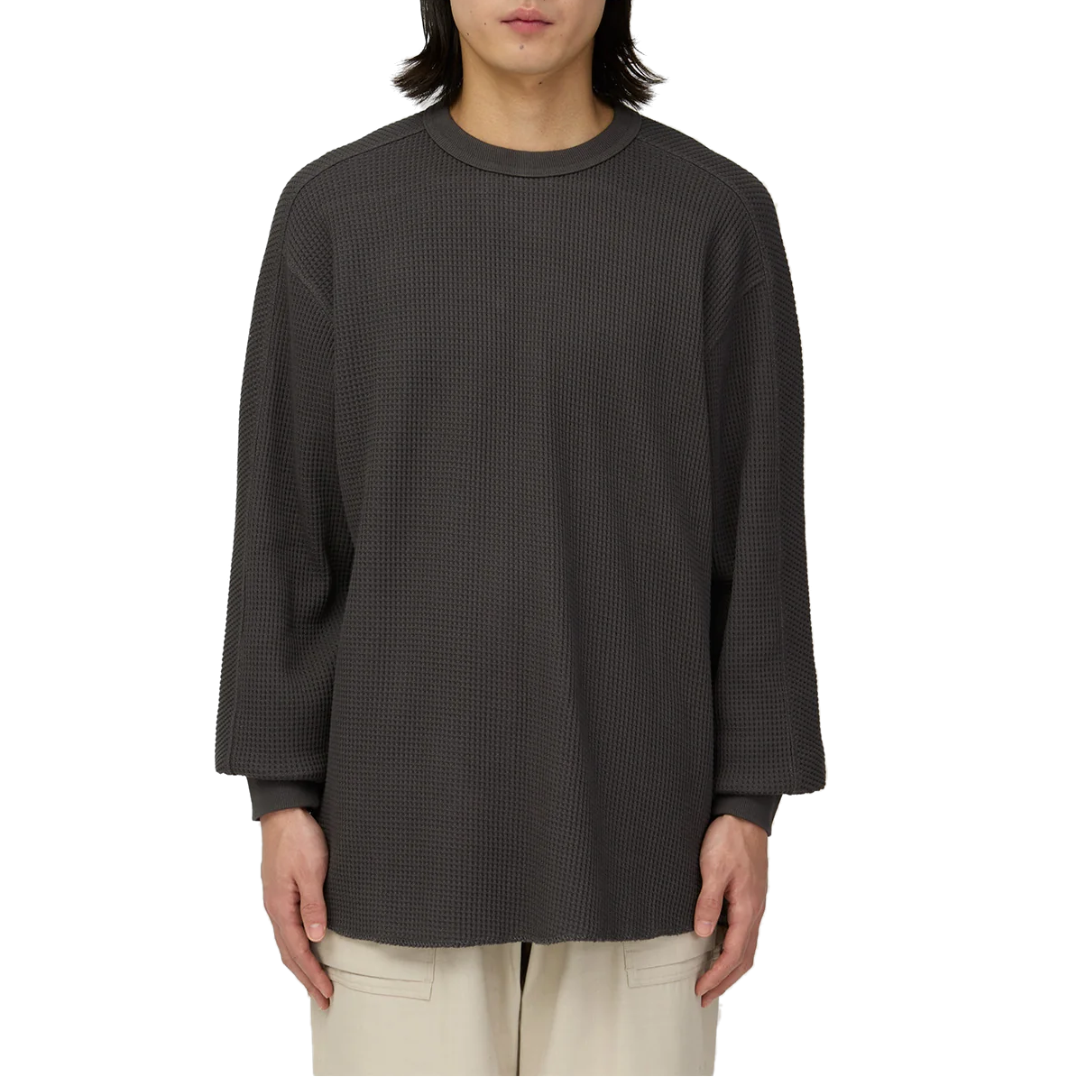 Waist-up view of a model wearing the charcoal Snow Peak Heavyweight Waffle Pullover, showing the relaxed fit, dropped shoulders and waffle-knit texture.