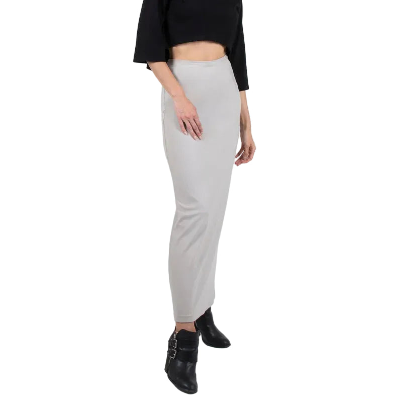 Person wearing a black top and light gray skirt on a white background